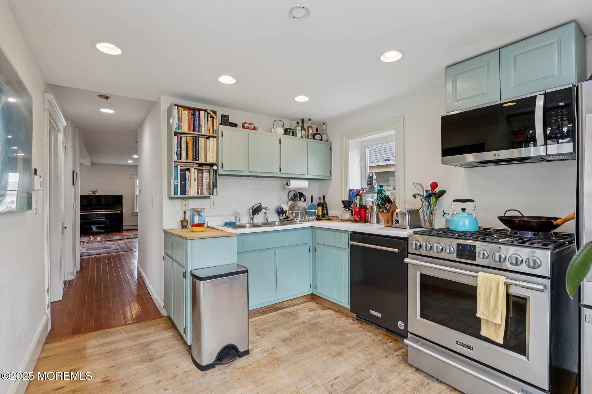 60 Lake Avenue Ocean Grove, NJ 07756 - Photo 30 of 66 a kitchen with stainless steel appliances granite countertop a stove and a sink