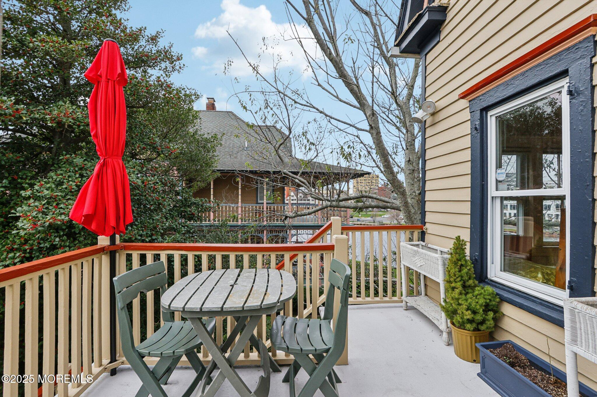 60 Lake Avenue Ocean Grove, NJ 07756 - Photo 32 of 66 a view of a brick house with wooden fence and a table