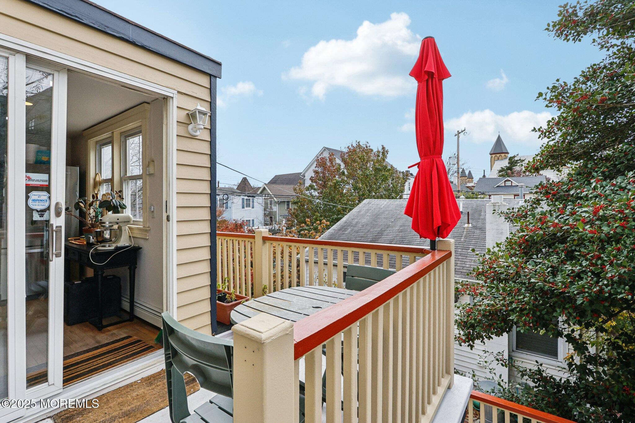 60 Lake Avenue Ocean Grove, NJ 07756 - Photo 33 of 66 a view of balcony with two chairs and a wooden fence