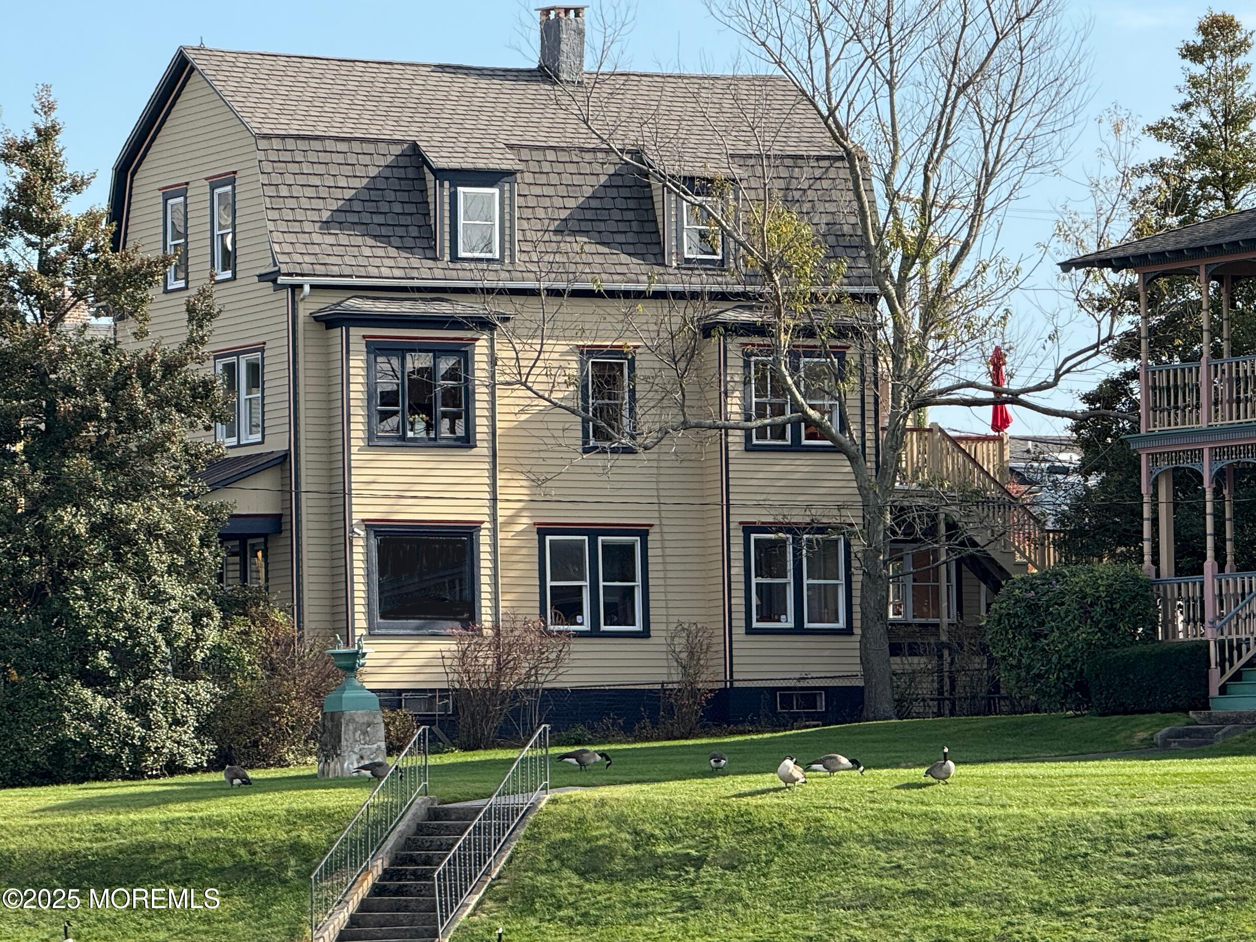 60 Lake Avenue Ocean Grove, NJ 07756 - Photo 4 of 66 a view of a yard in front of a house