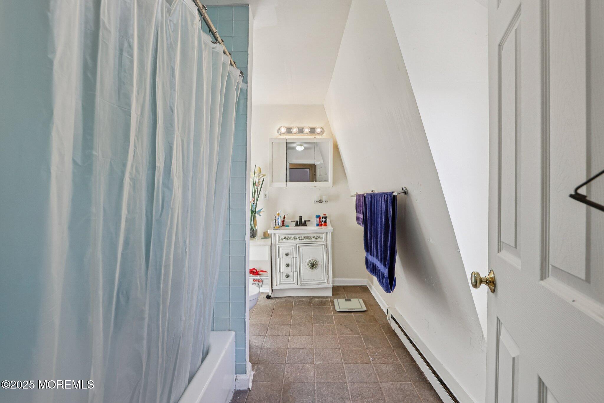 60 Lake Avenue Ocean Grove, NJ 07756 - Photo 41 of 66 a view of a hallway with washer and dryer