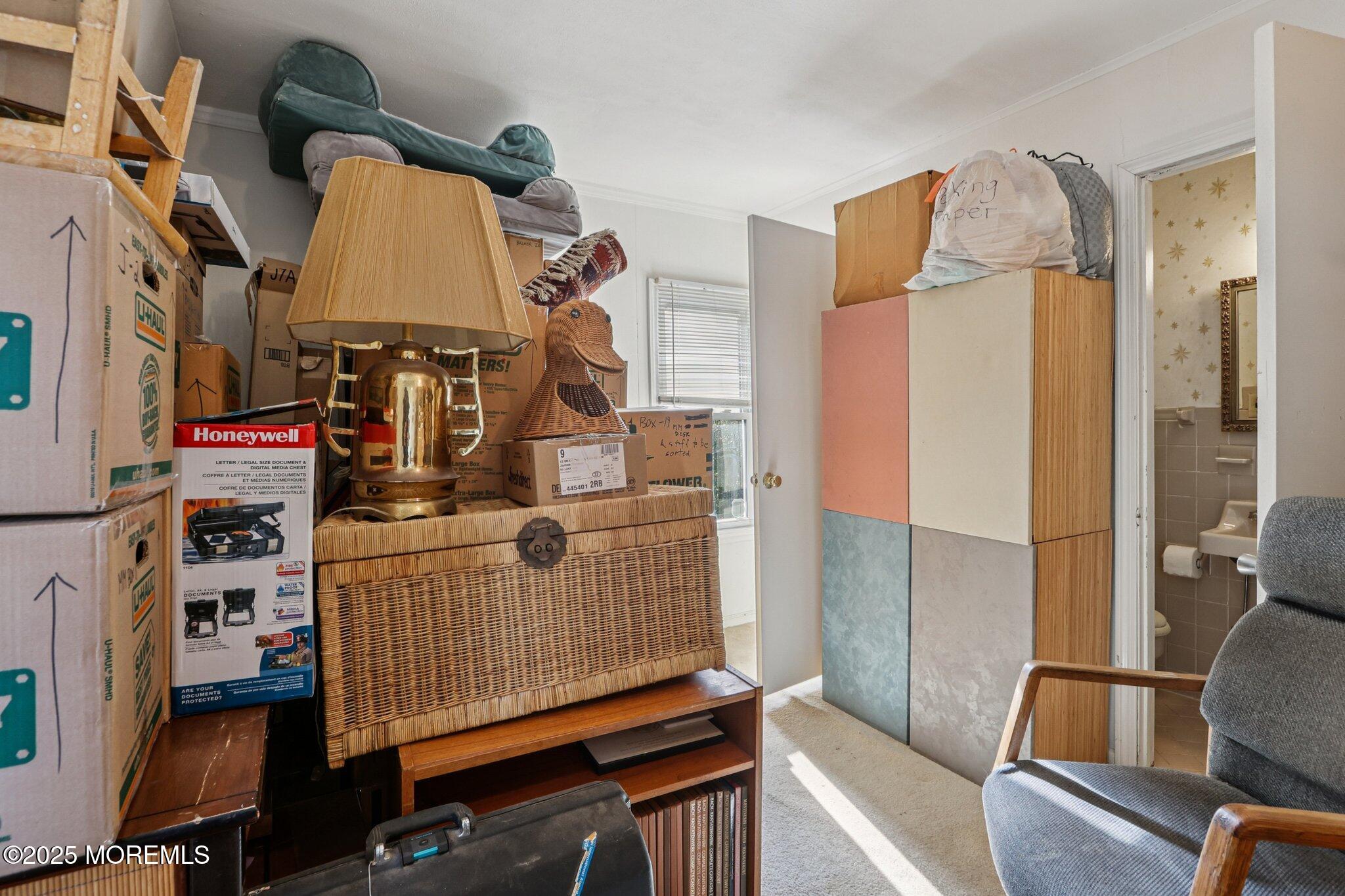 60 Lake Avenue Ocean Grove, NJ 07756 - Photo 43 of 66 a view of walk in closet with clothes and shoes