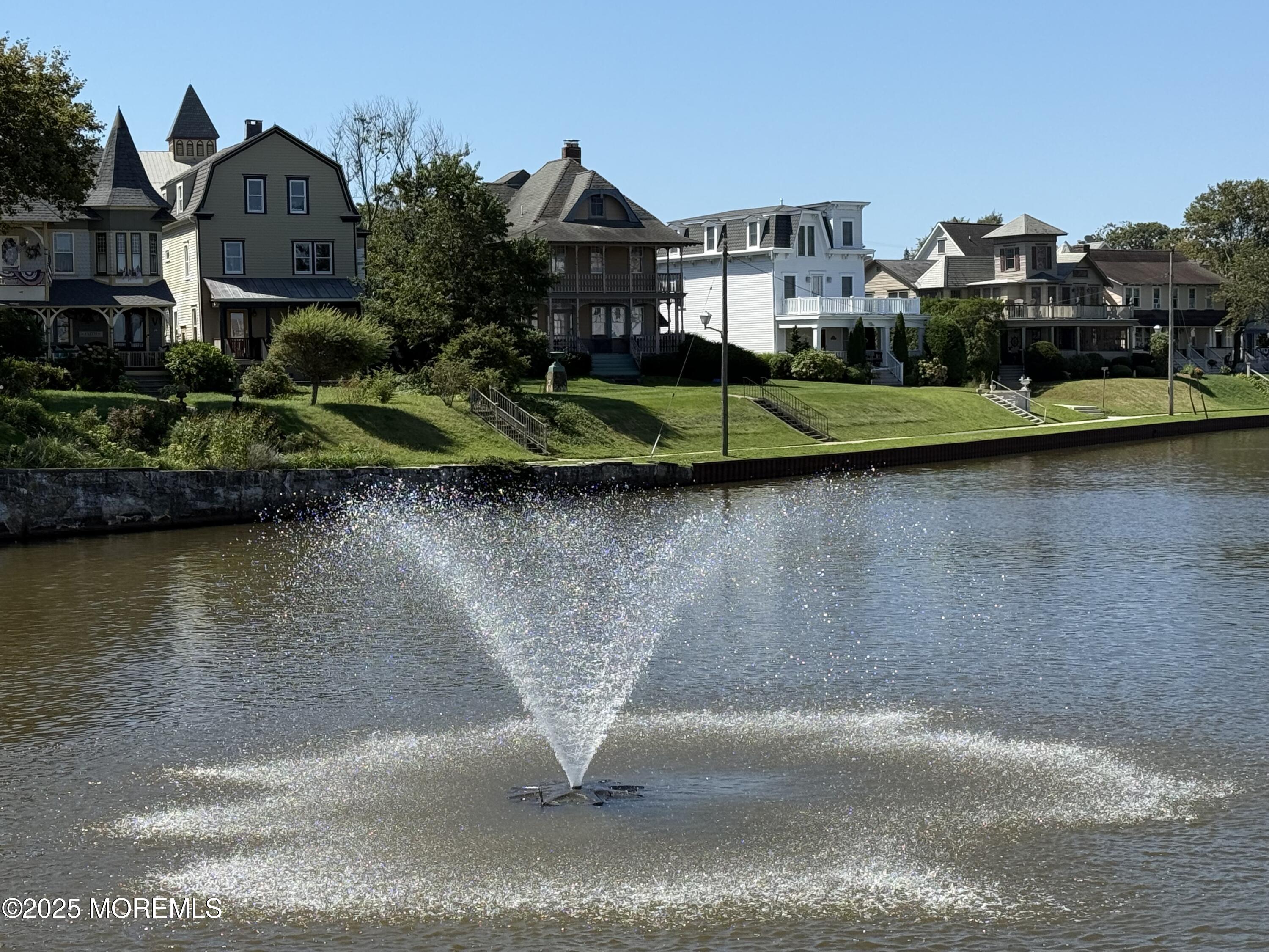 60 Lake Avenue Ocean Grove, NJ 07756 - Photo 57 of 66 a view of a house with a yard and a pond