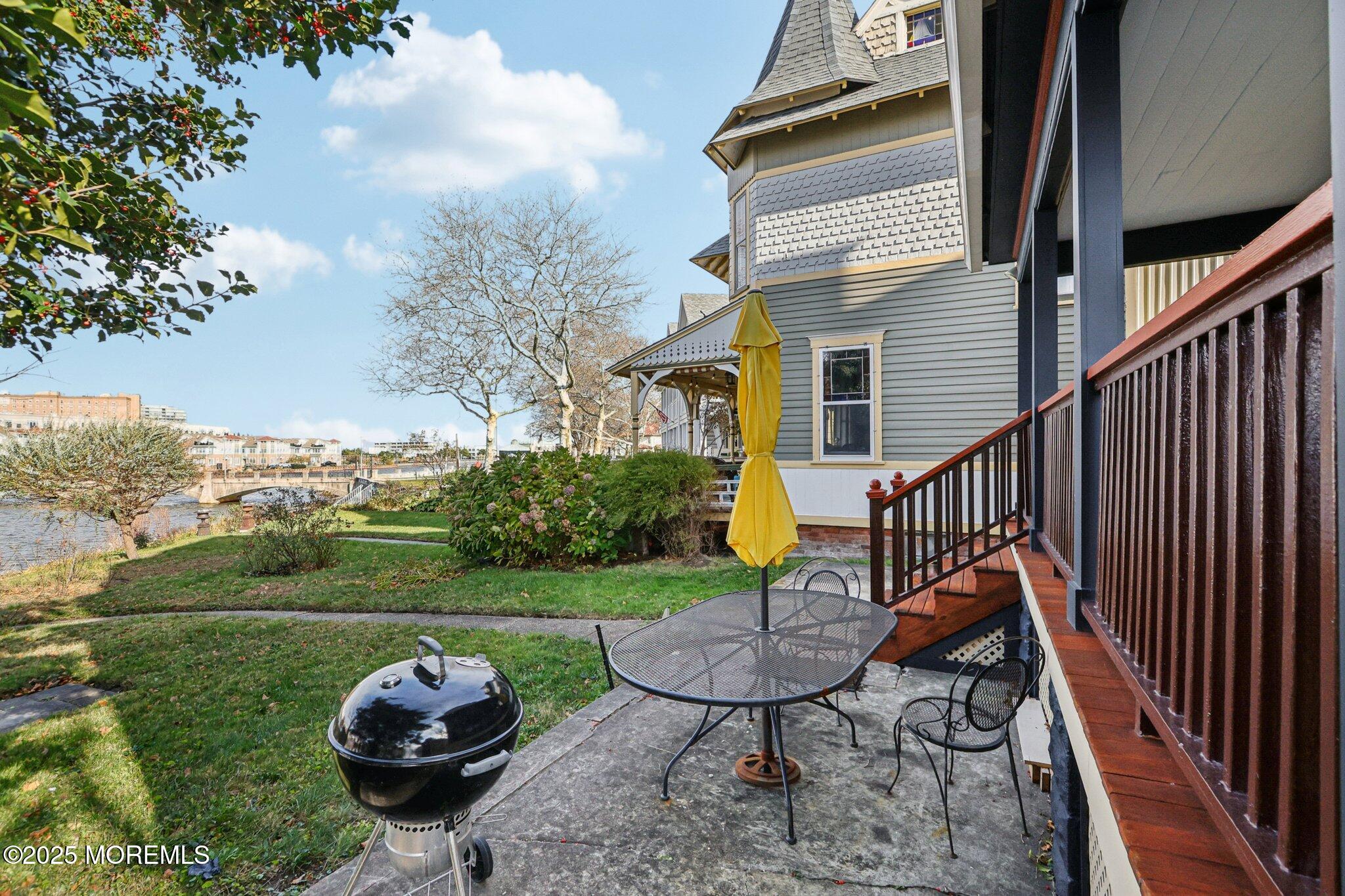 60 Lake Avenue Ocean Grove, NJ 07756 - Photo 6 of 66 a view of a porch with furniture and a yard