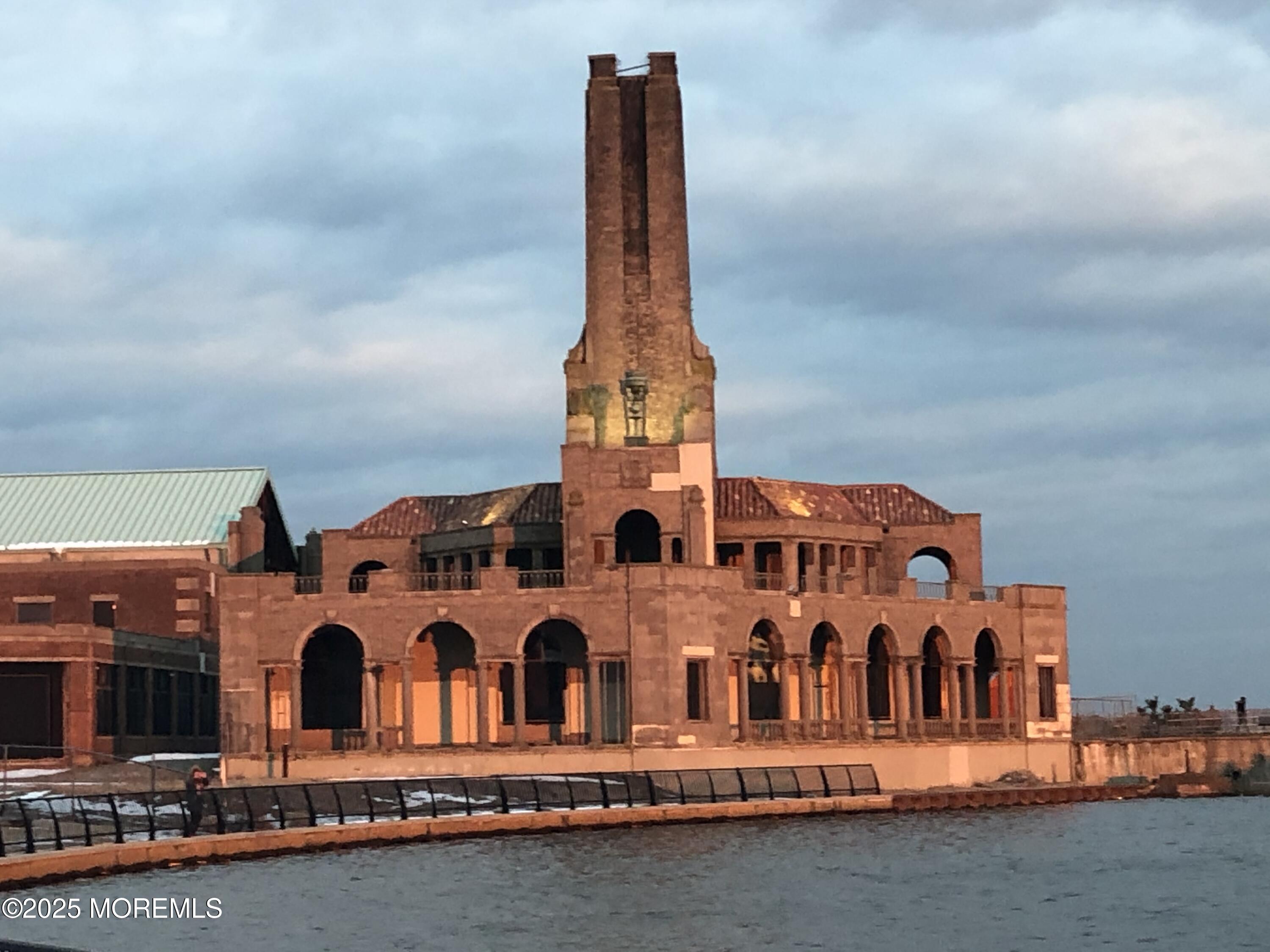 60 Lake Avenue Ocean Grove, NJ 07756 - Photo 66 of 66 a front view of a building with glass windows and a yard