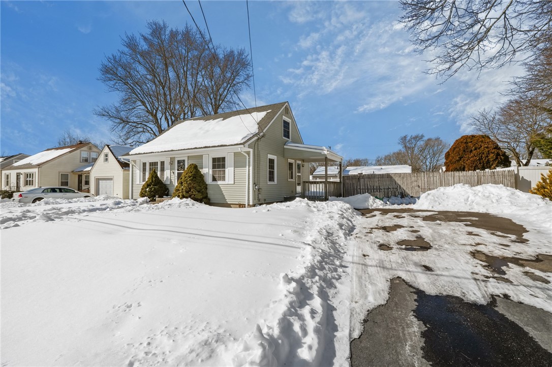 65 Almy Street Warwick, RI 02886 - Photo 2 of 34 Side view with long driveway and kitchen access