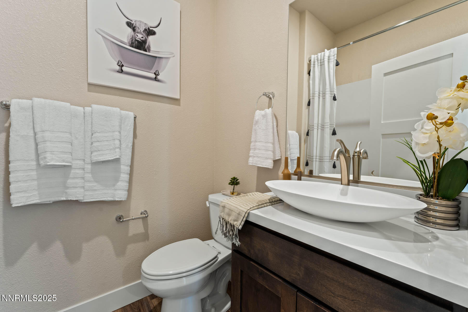 150 East Roland Street, Unit BLDG 1803 Carson City, NV 89701 - Photo 12 of 18 a bathroom with a granite countertop toilet sink and mirror