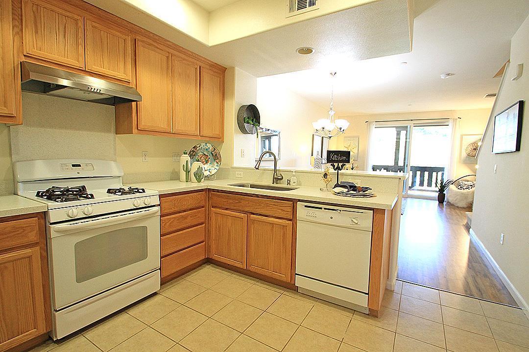 a kitchen with appliances cabinets and furniture