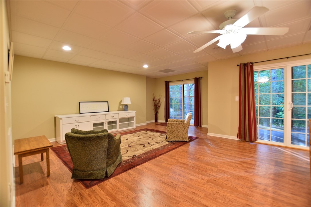 15023 Beacon Ridge Drive Seneca, SC 29678 - Photo 30 of 38 This rooms says sectional and a big screen televis
