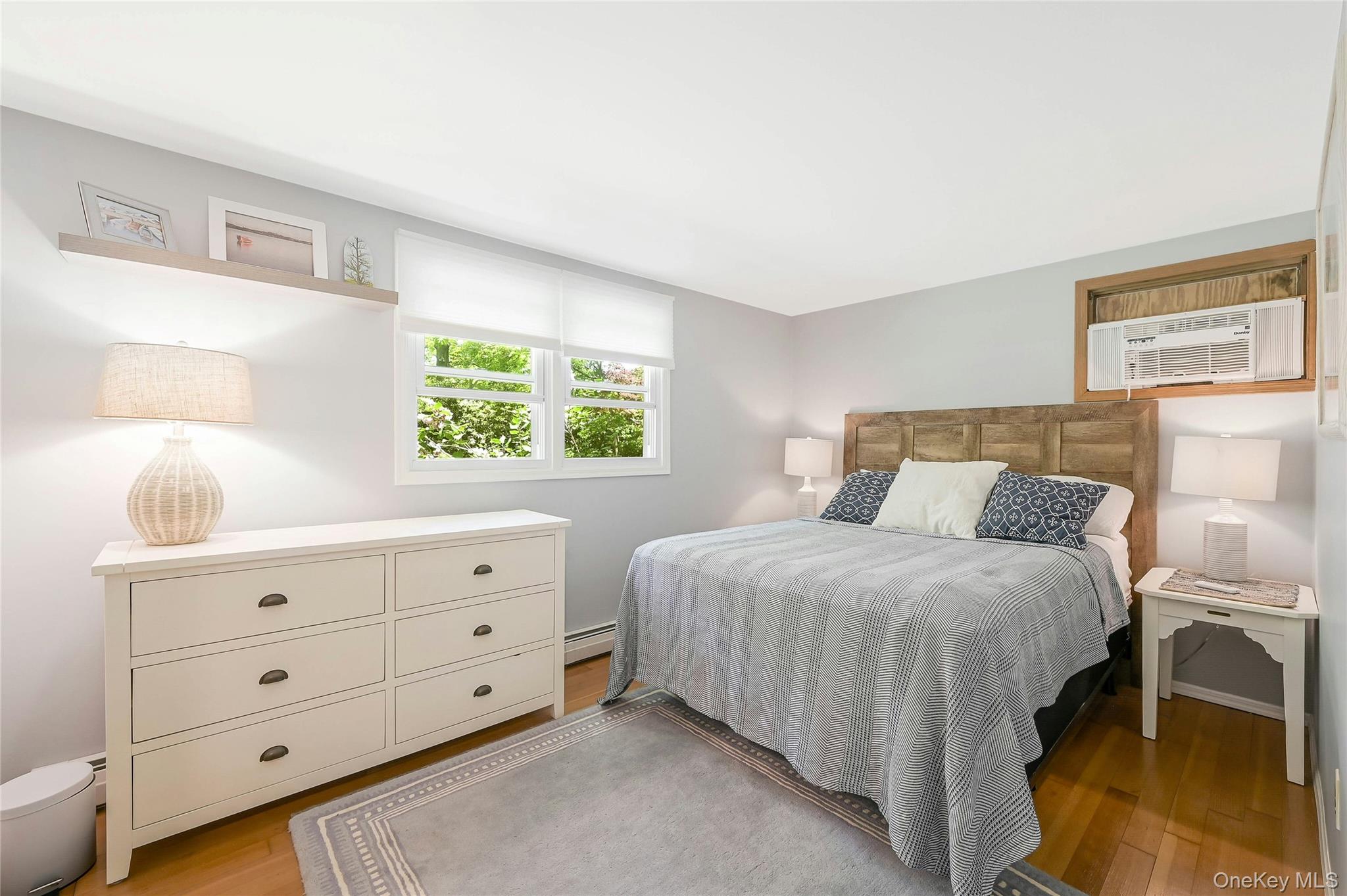 340 Pine Road Southold, NY 11971 - Photo 8 of 23 a bedroom with a bed and a window