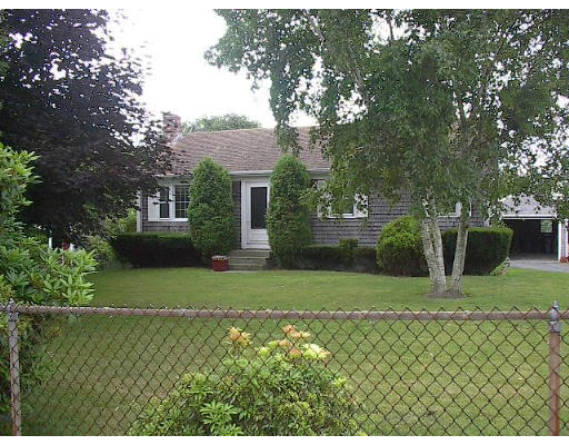 715 E Road Tiverton, RI 02878 - Photo 1 of 4 a front view of a house with a yard