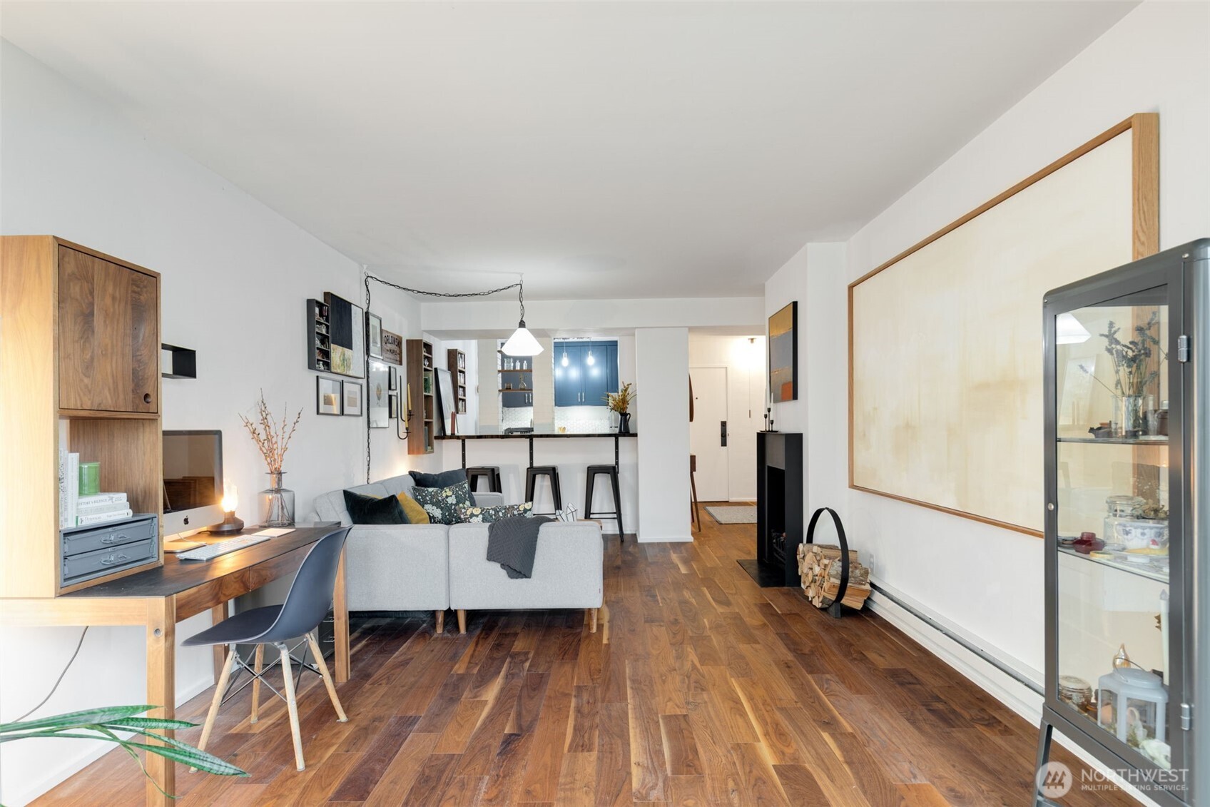 308 East Republican Street, Unit 513 Seattle, WA 98102 - Photo 11 of 40 a view of a dining room with furniture and wooden floor