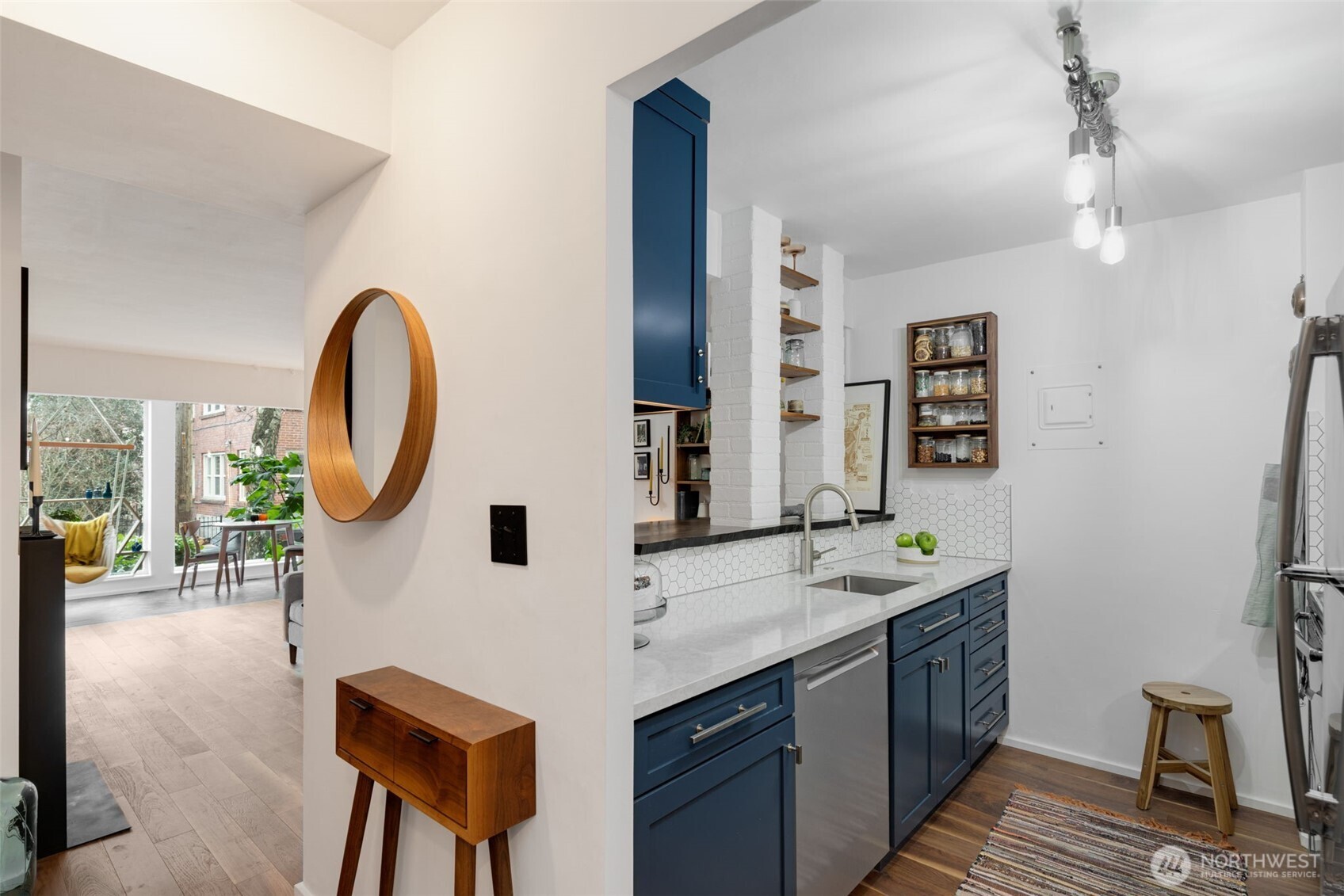 308 East Republican Street, Unit 513 Seattle, WA 98102 - Photo 13 of 40 a bathroom with a sink and a mirror