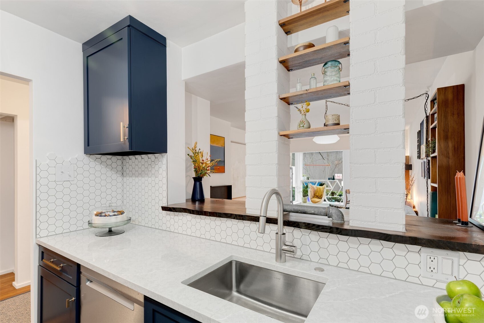 308 East Republican Street, Unit 513 Seattle, WA 98102 - Photo 16 of 40 a kitchen with a sink and a refrigerator