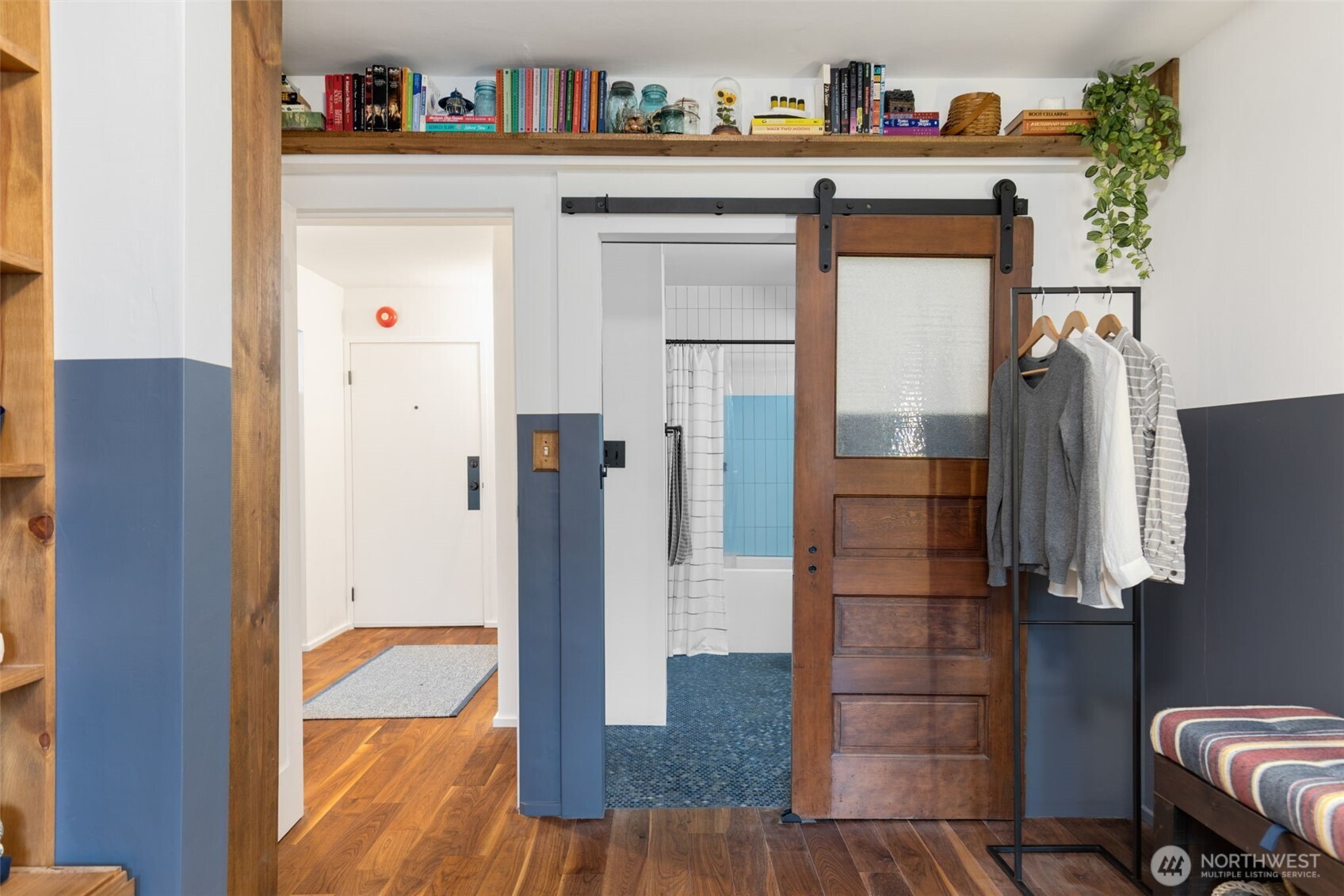 308 East Republican Street, Unit 513 Seattle, WA 98102 - Photo 23 of 40 view of hall way with mirror and furniture