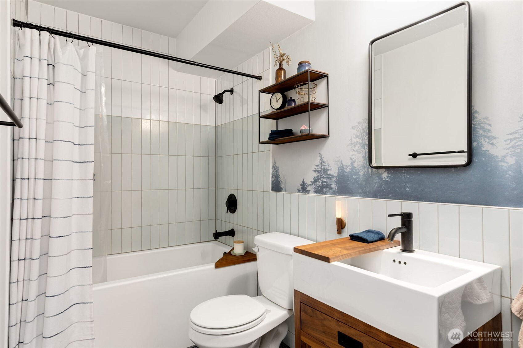 308 East Republican Street, Unit 513 Seattle, WA 98102 - Photo 24 of 40 a bathroom with a sink a toilet and shower