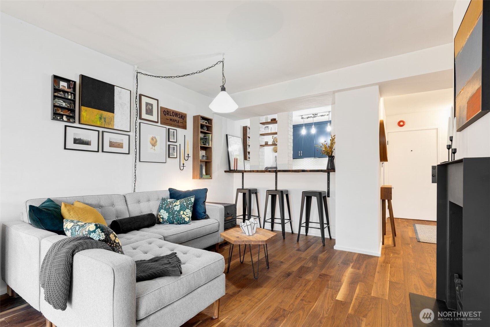 308 East Republican Street, Unit 513 Seattle, WA 98102 - Photo 6 of 40 a living room with furniture and a flat screen tv