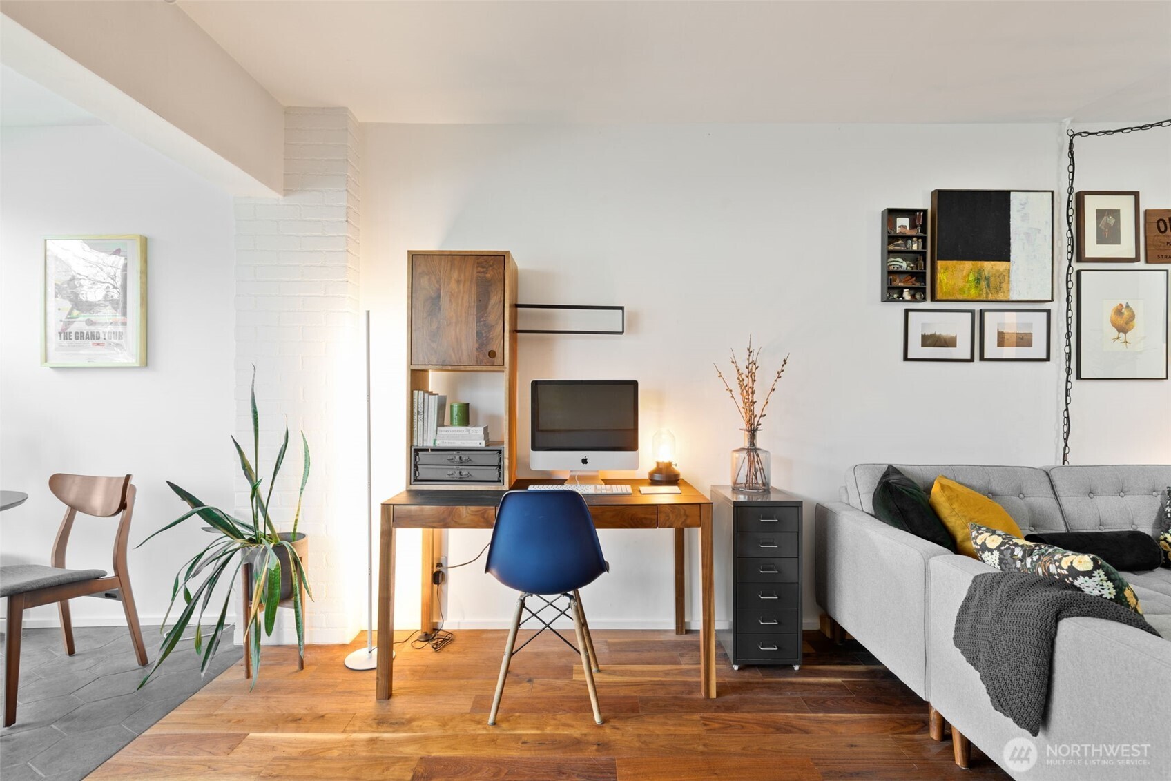 308 East Republican Street, Unit 513 Seattle, WA 98102 - Photo 8 of 40 a workspace with furniture and a couch