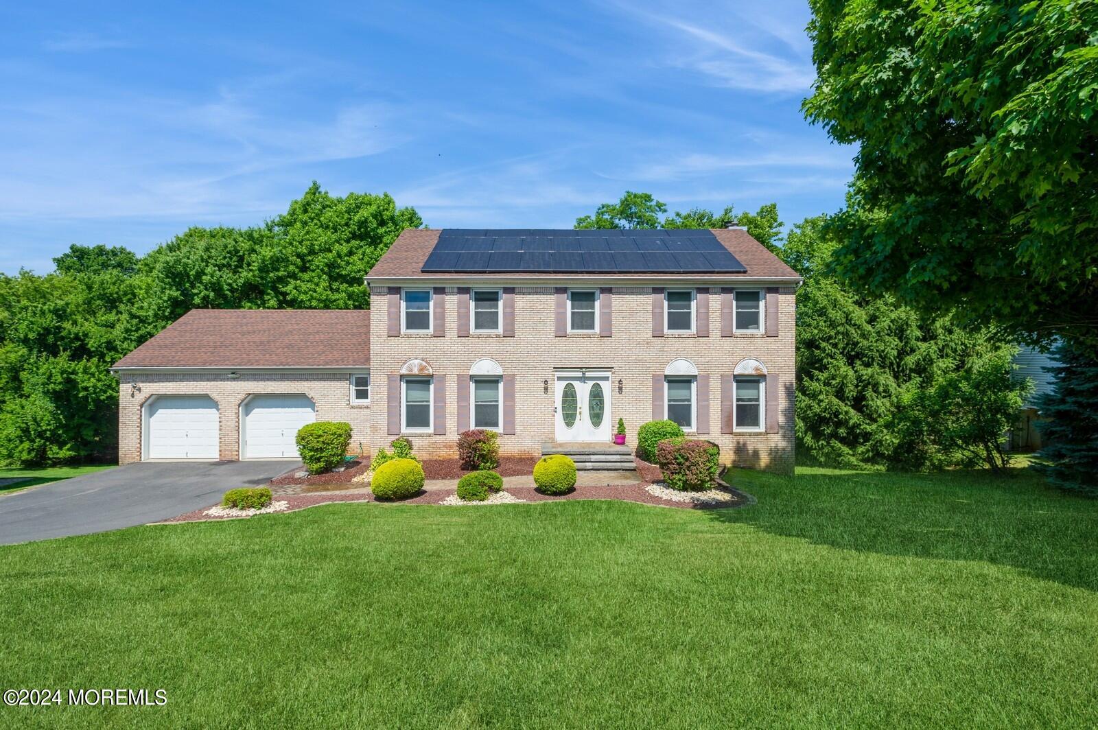 212 Nottingham Road Morganville, NJ 07751 - Photo 1 of 24 a front view of house with yard and green space