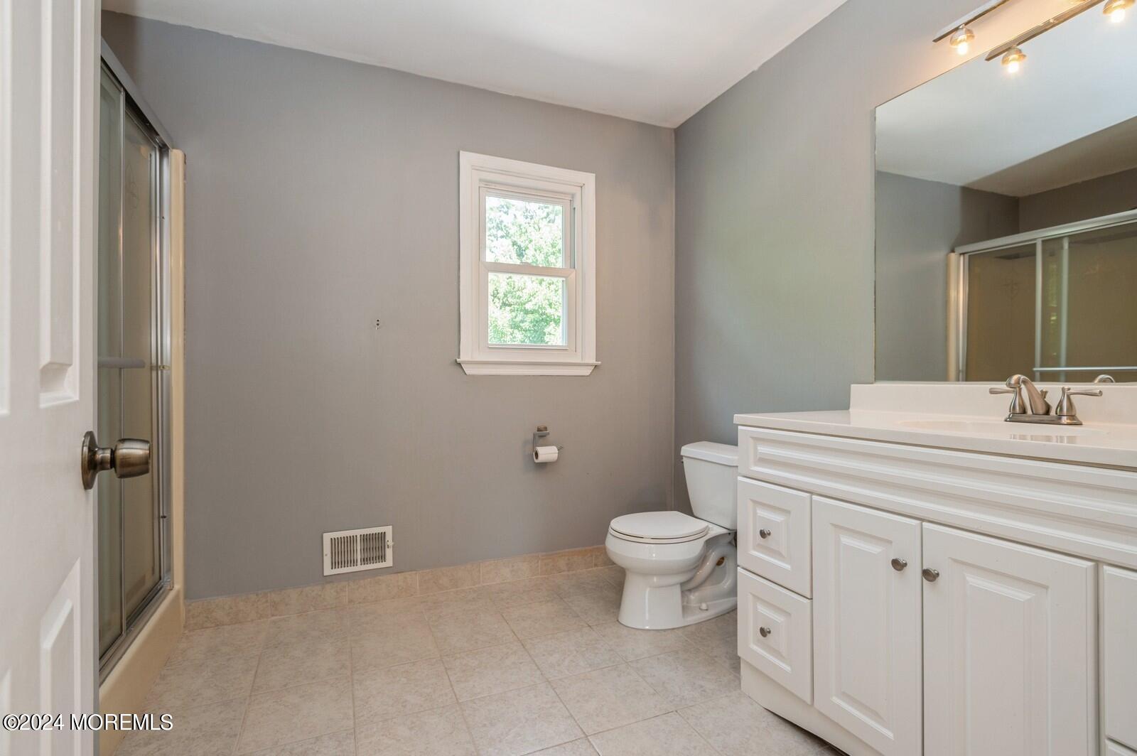 212 Nottingham Road Morganville, NJ 07751 - Photo 16 of 24 a bathroom with a sink toilet and shower