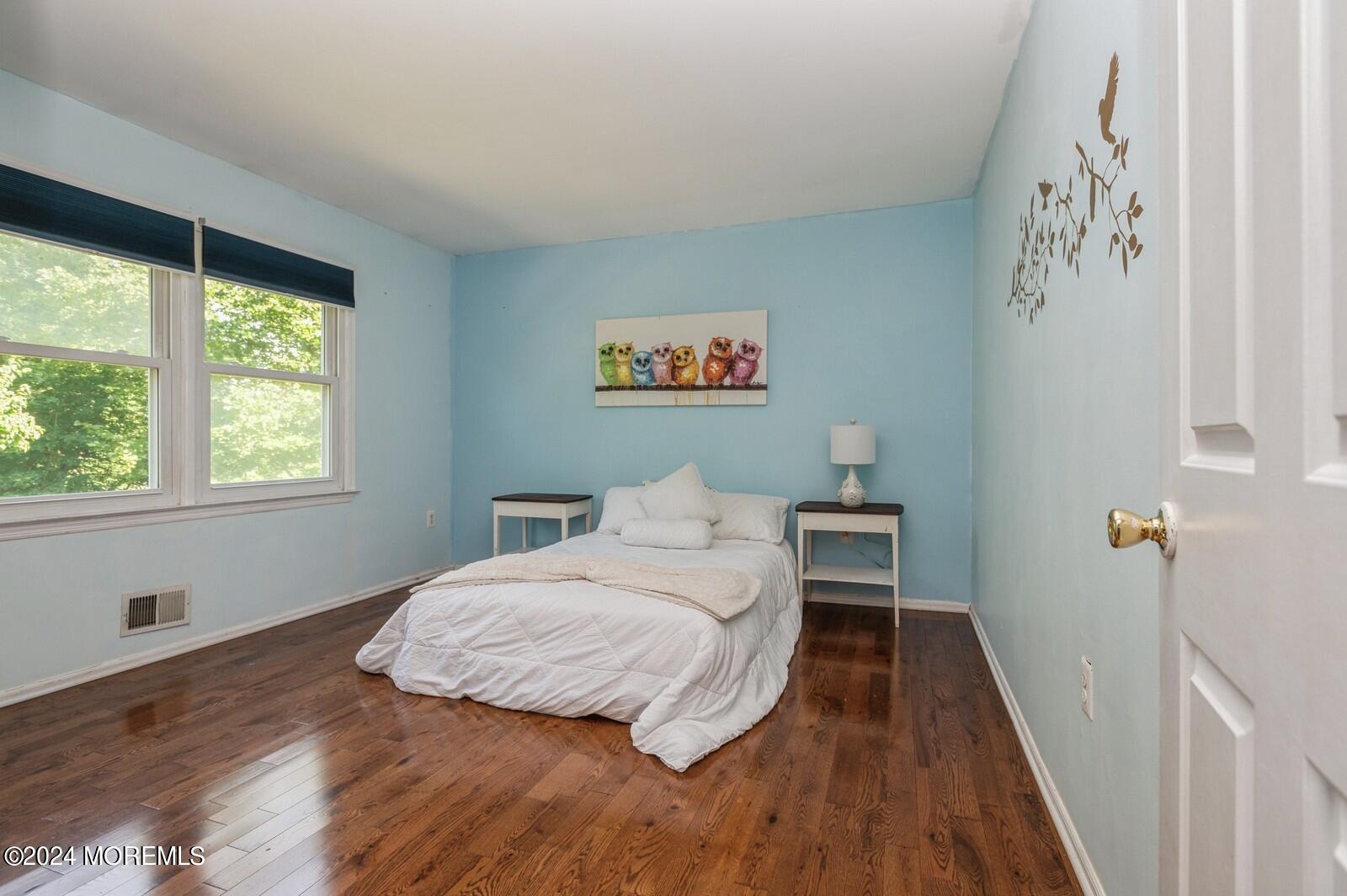 212 Nottingham Road Morganville, NJ 07751 - Photo 17 of 24 a bedroom with a bed and a window