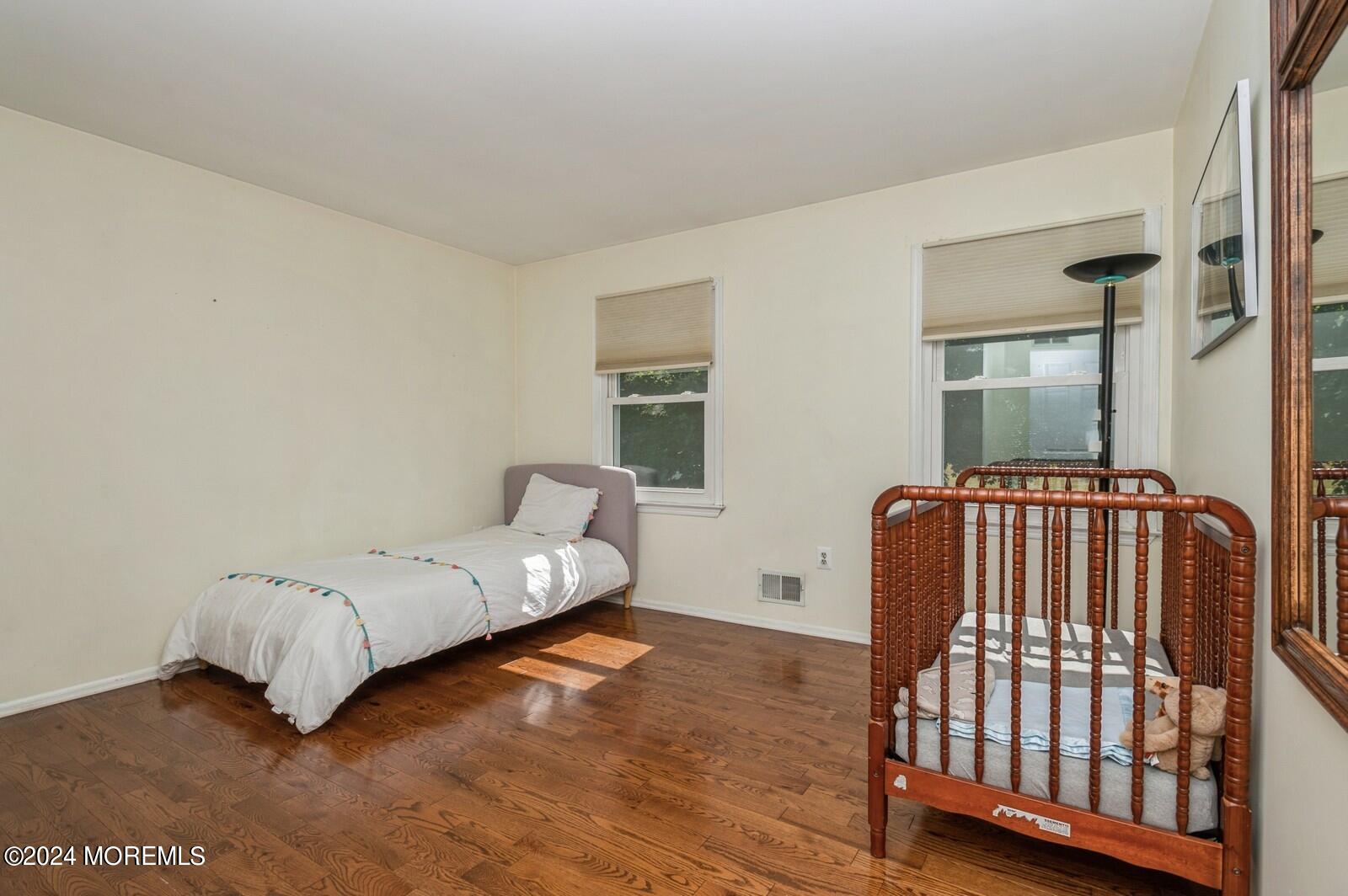 212 Nottingham Road Morganville, NJ 07751 - Photo 18 of 24 a bedroom with a bed and a window