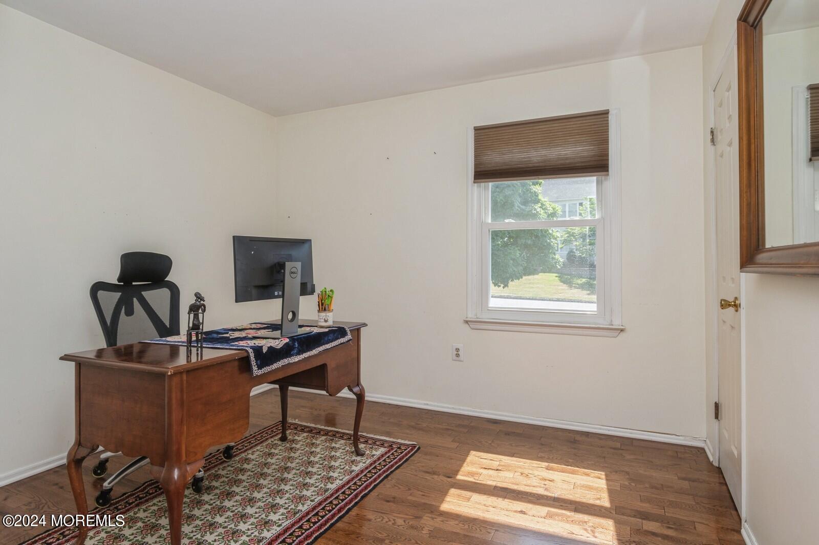 212 Nottingham Road Morganville, NJ 07751 - Photo 19 of 24 a view of a workspace with furniture and a window