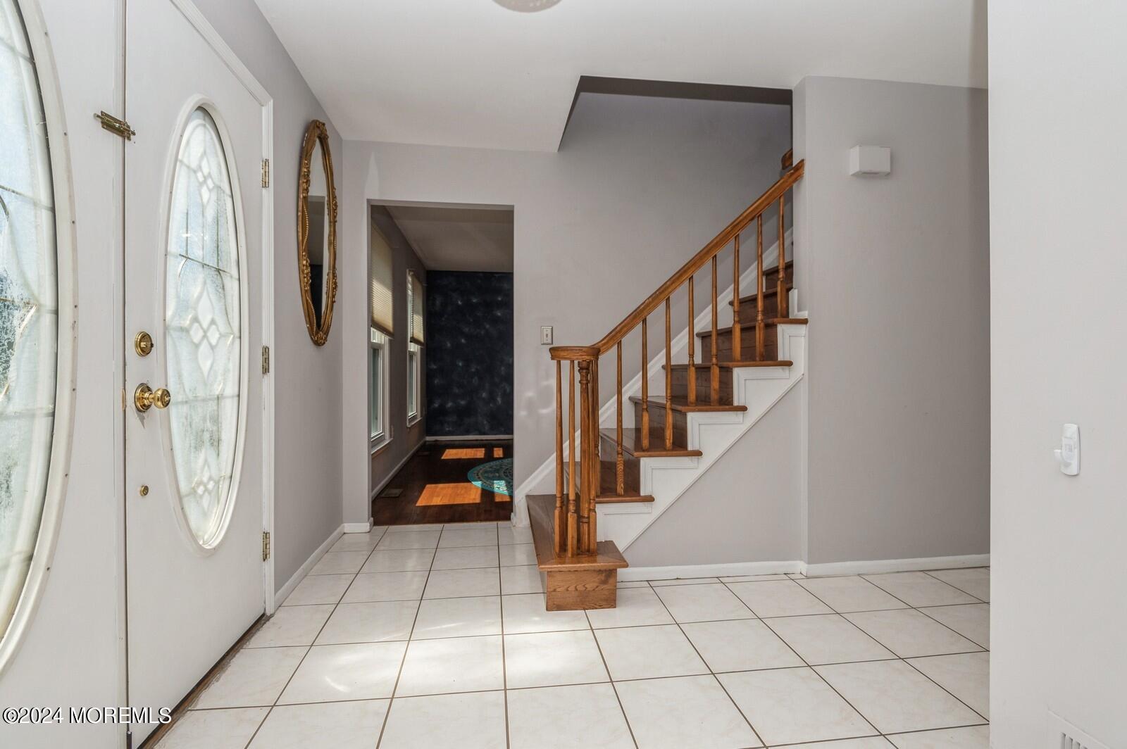 212 Nottingham Road Morganville, NJ 07751 - Photo 2 of 24 a view of an entryway with staircase