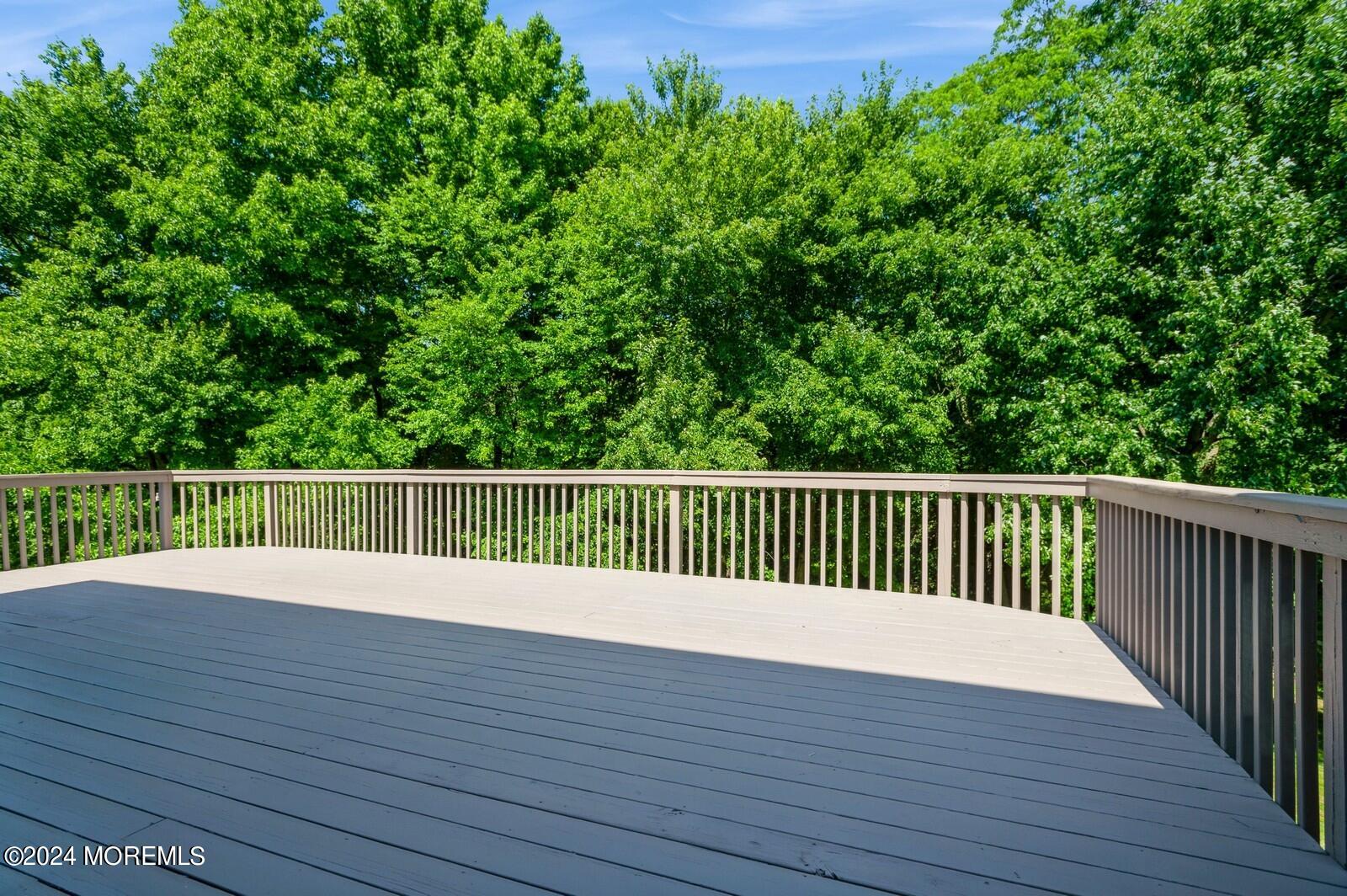 212 Nottingham Road Morganville, NJ 07751 - Photo 22 of 24 a view of deck with a wooden fence