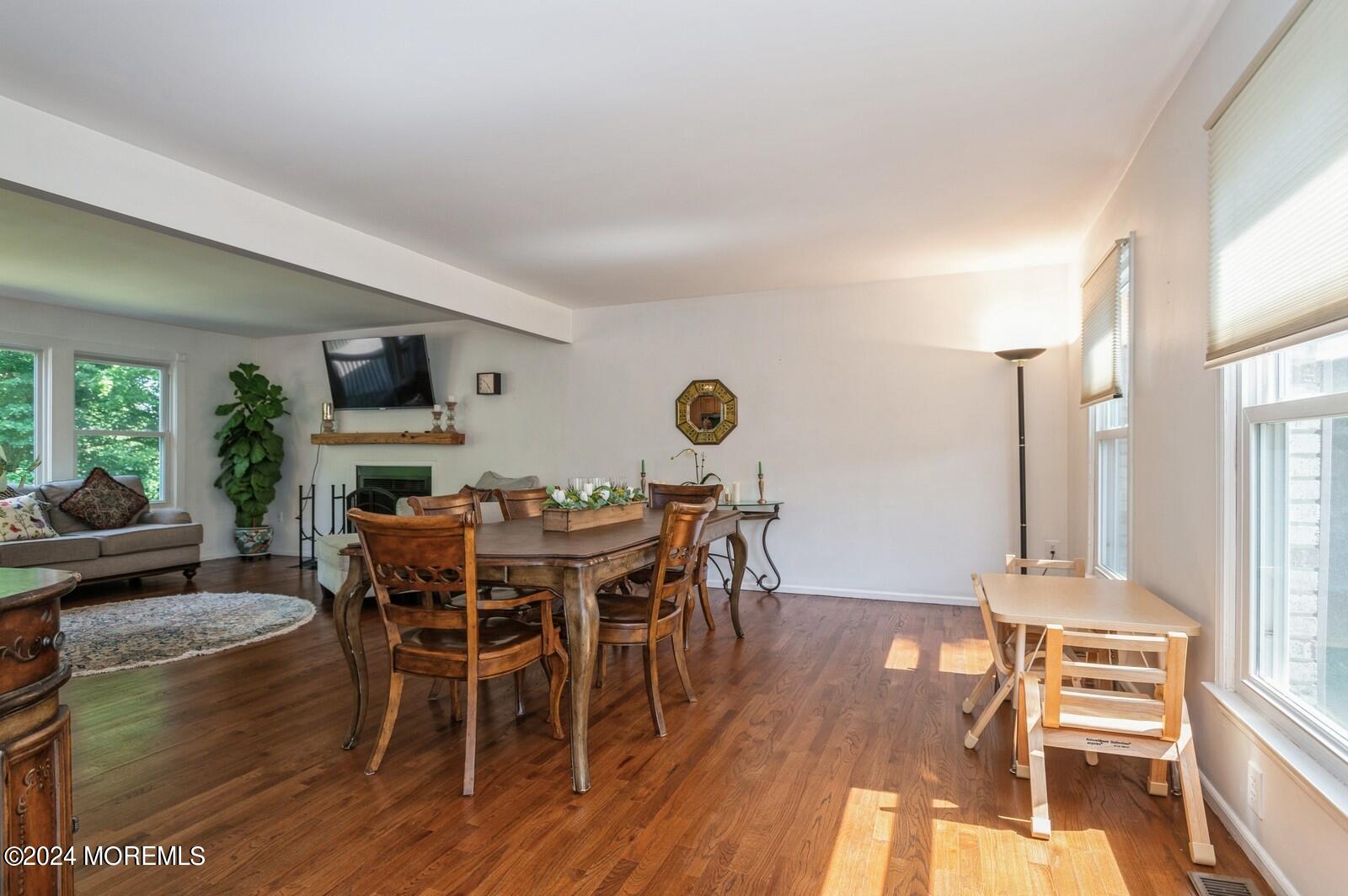 212 Nottingham Road Morganville, NJ 07751 - Photo 4 of 24 a view of a dining room with furniture window and wooden floor