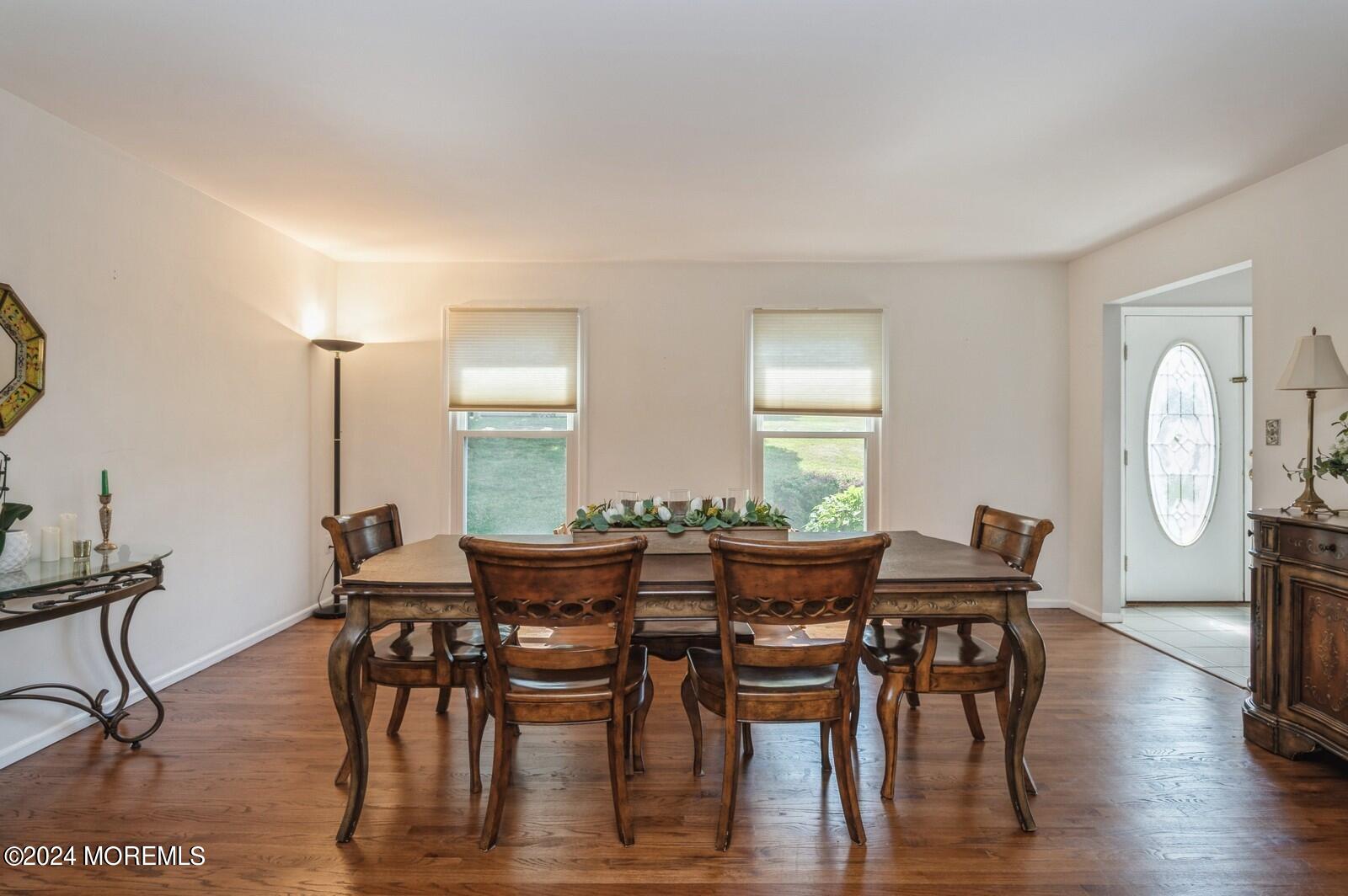 212 Nottingham Road Morganville, NJ 07751 - Photo 5 of 24 a view of a dining room with furniture window and wooden floor