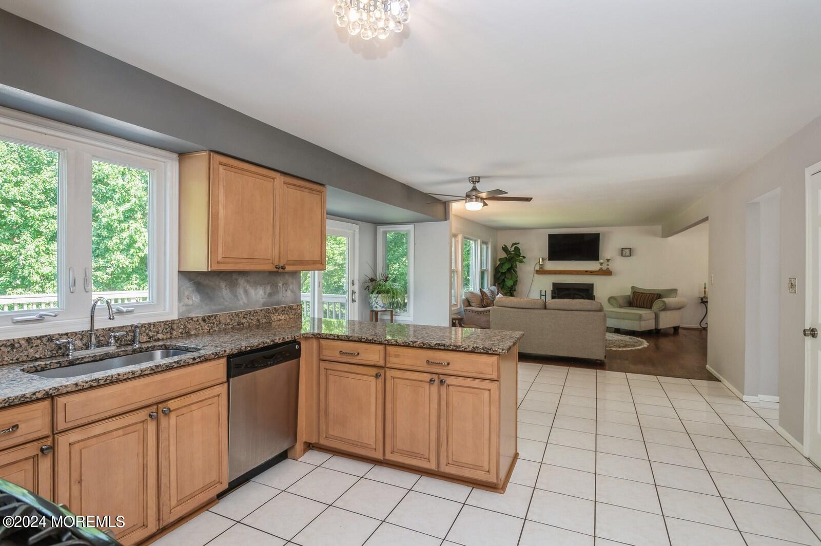 212 Nottingham Road Morganville, NJ 07751 - Photo 8 of 24 a kitchen with a sink window and cabinets