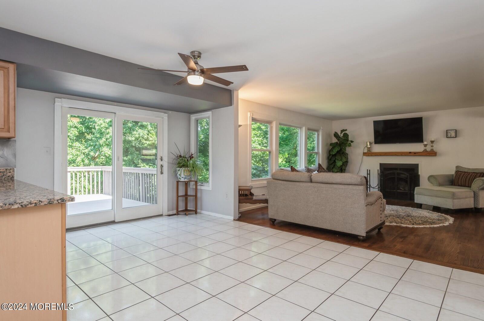 212 Nottingham Road Morganville, NJ 07751 - Photo 10 of 24 a living room with furniture and a fireplace