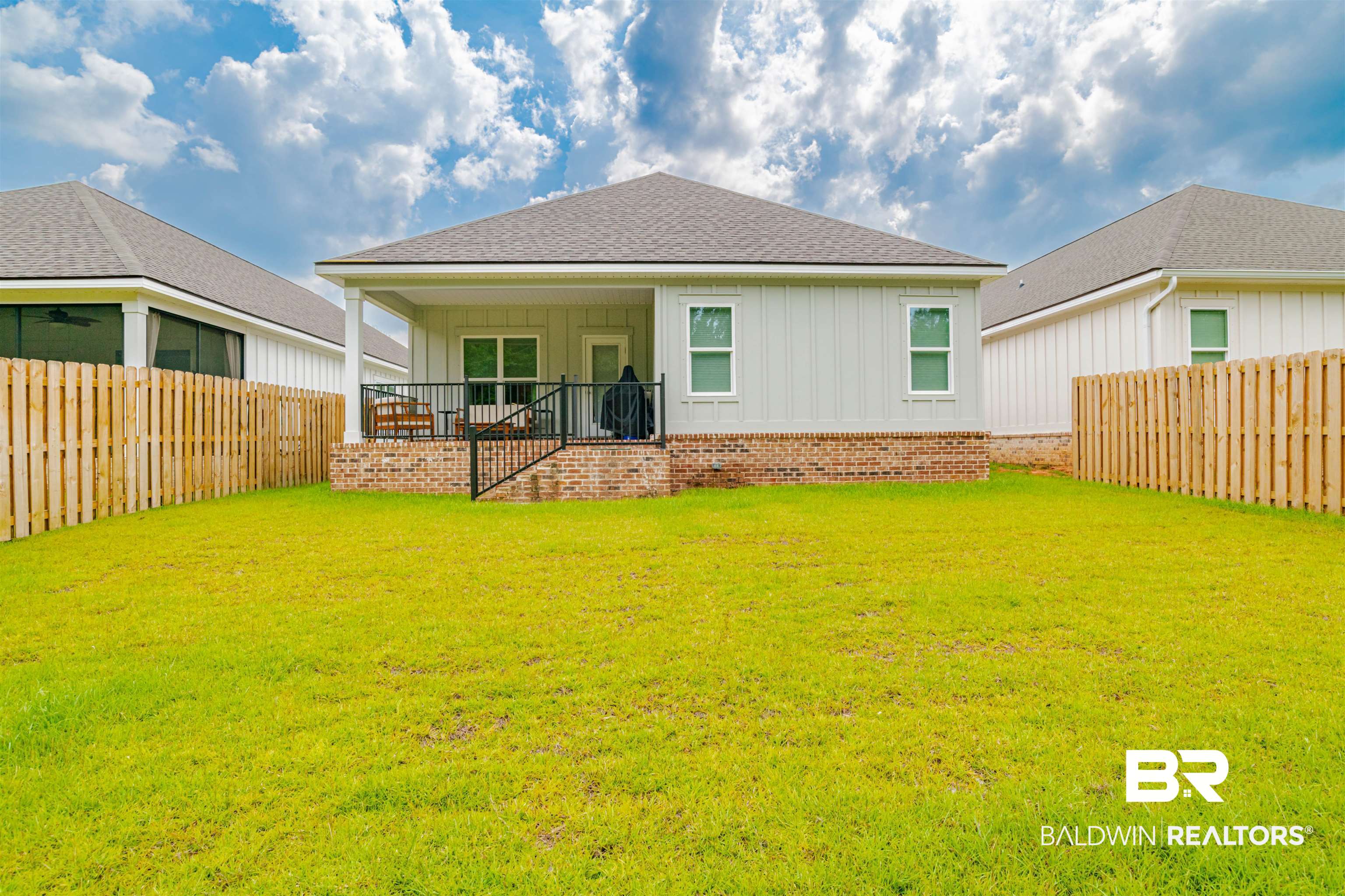 655 H Norman Lane Fairhope, AL 36532 - Photo 27 of 30 Rear view of property with a lawn