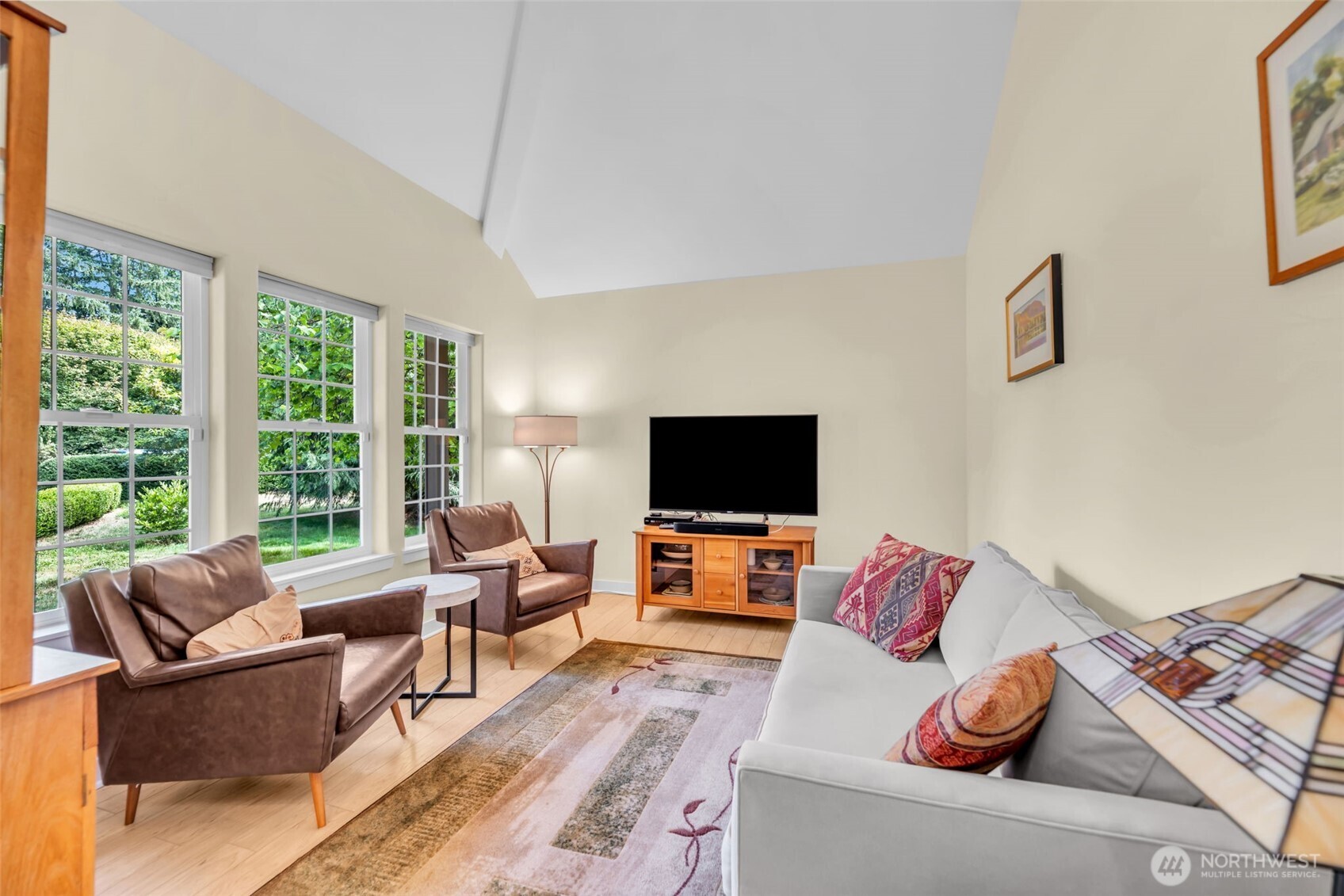 18005 252nd Avenue Southeast Maple Valley, WA 98038 - Photo 11 of 40 a living room with furniture and a flat screen tv