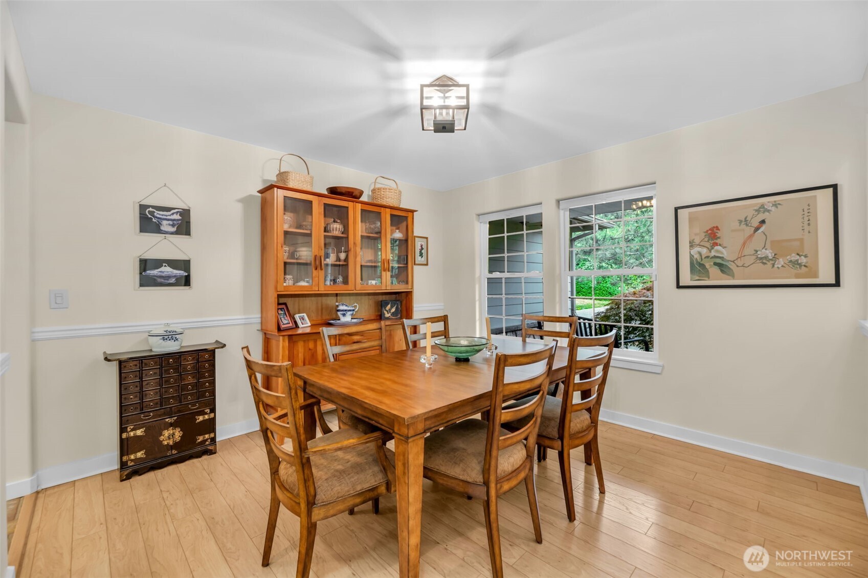 18005 252nd Avenue Southeast Maple Valley, WA 98038 - Photo 12 of 40 a view of a dining room with furniture window and wooden floor