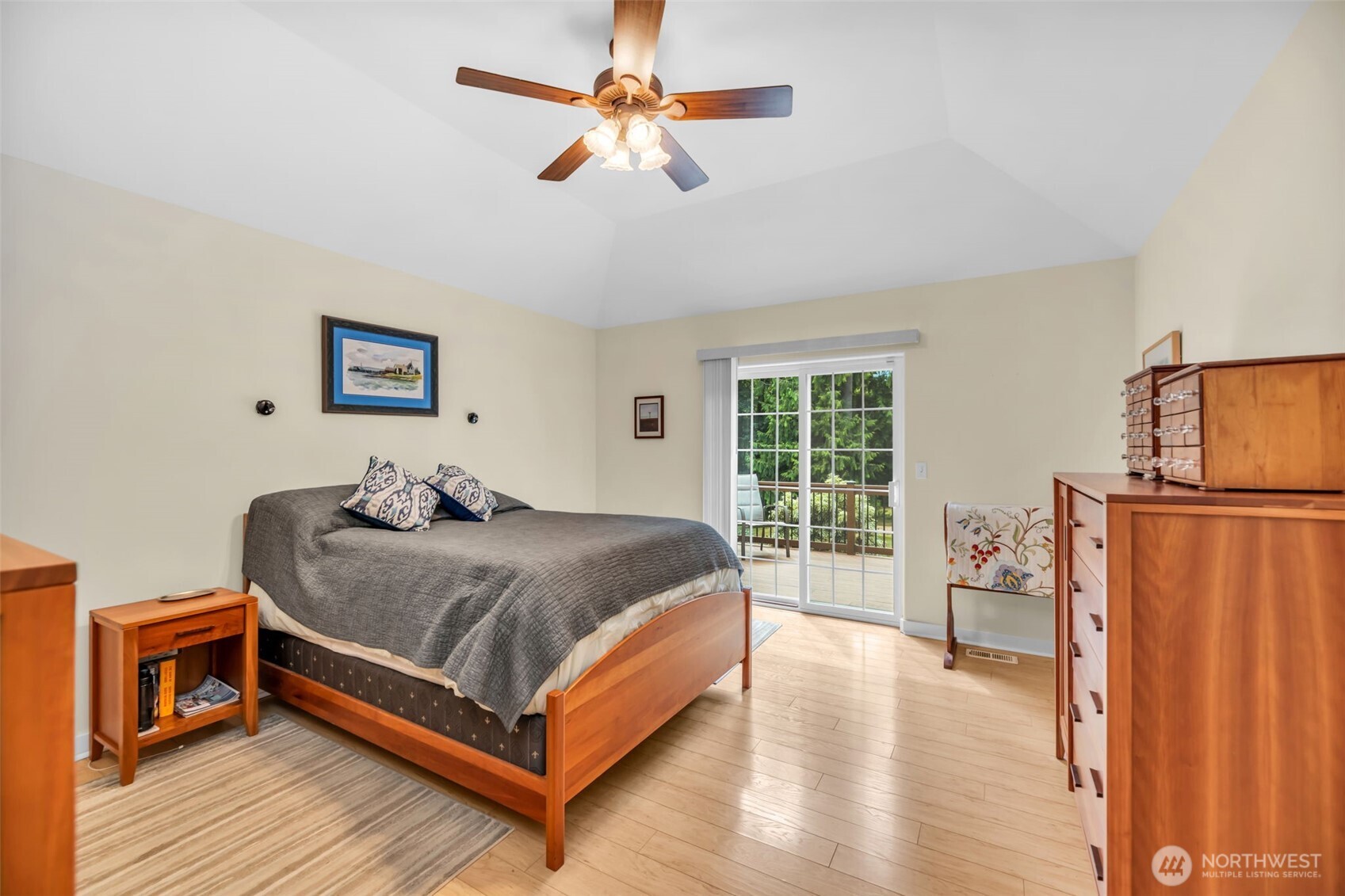 18005 252nd Avenue Southeast Maple Valley, WA 98038 - Photo 15 of 40 a bedroom with a bed and wooden floor