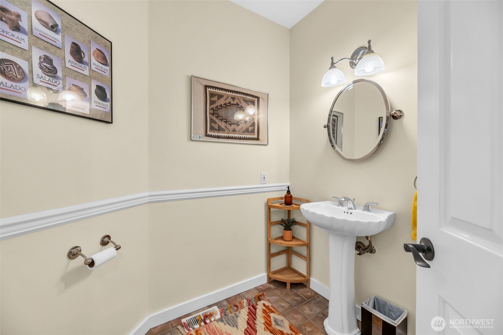 18005 252nd Avenue Southeast Maple Valley, WA 98038 - Photo 19 of 40 a bathroom with a sink and mirror with toilet
