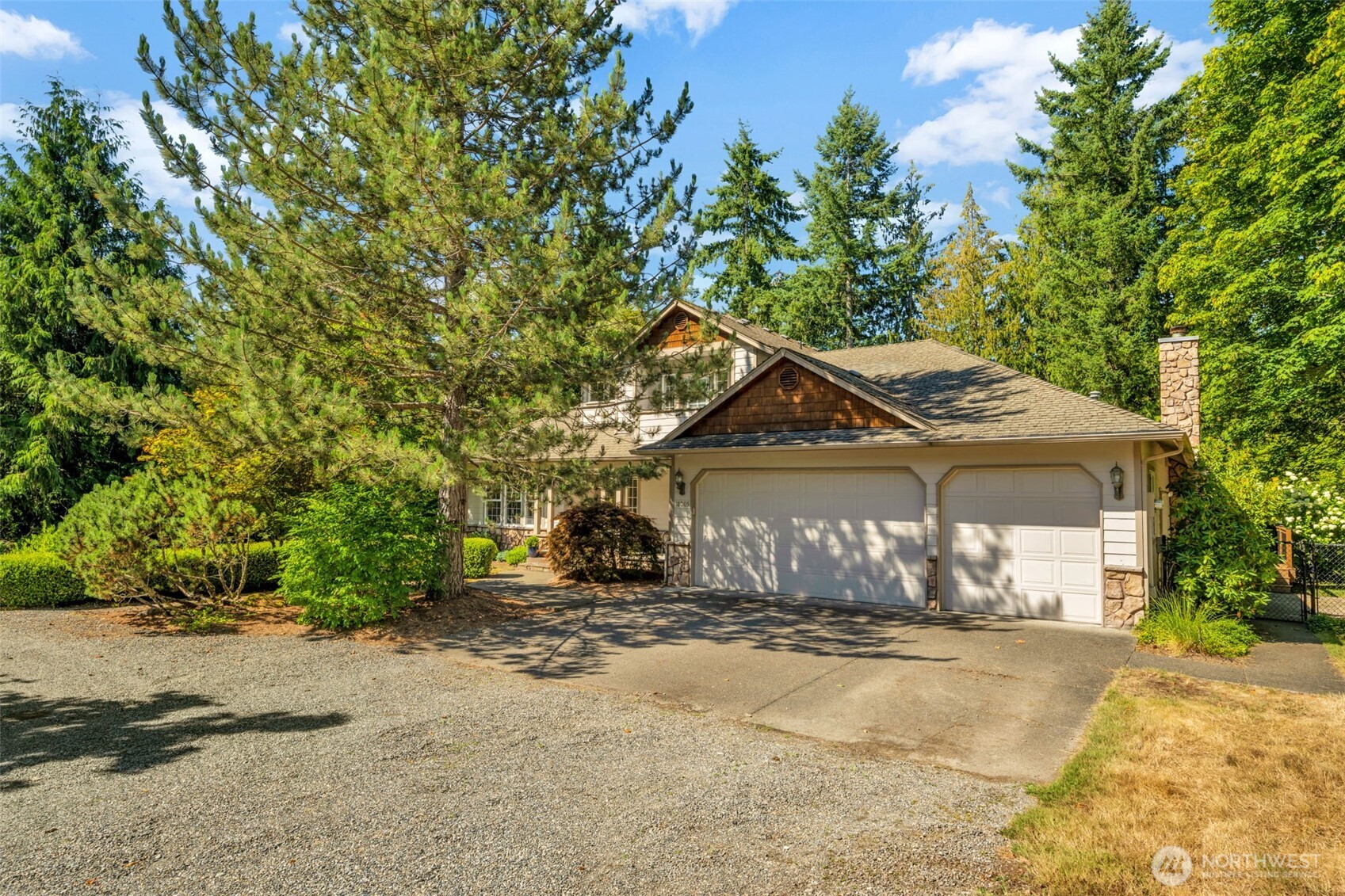 18005 252nd Avenue Southeast Maple Valley, WA 98038 - Photo 2 of 40 a view of a house with a yard