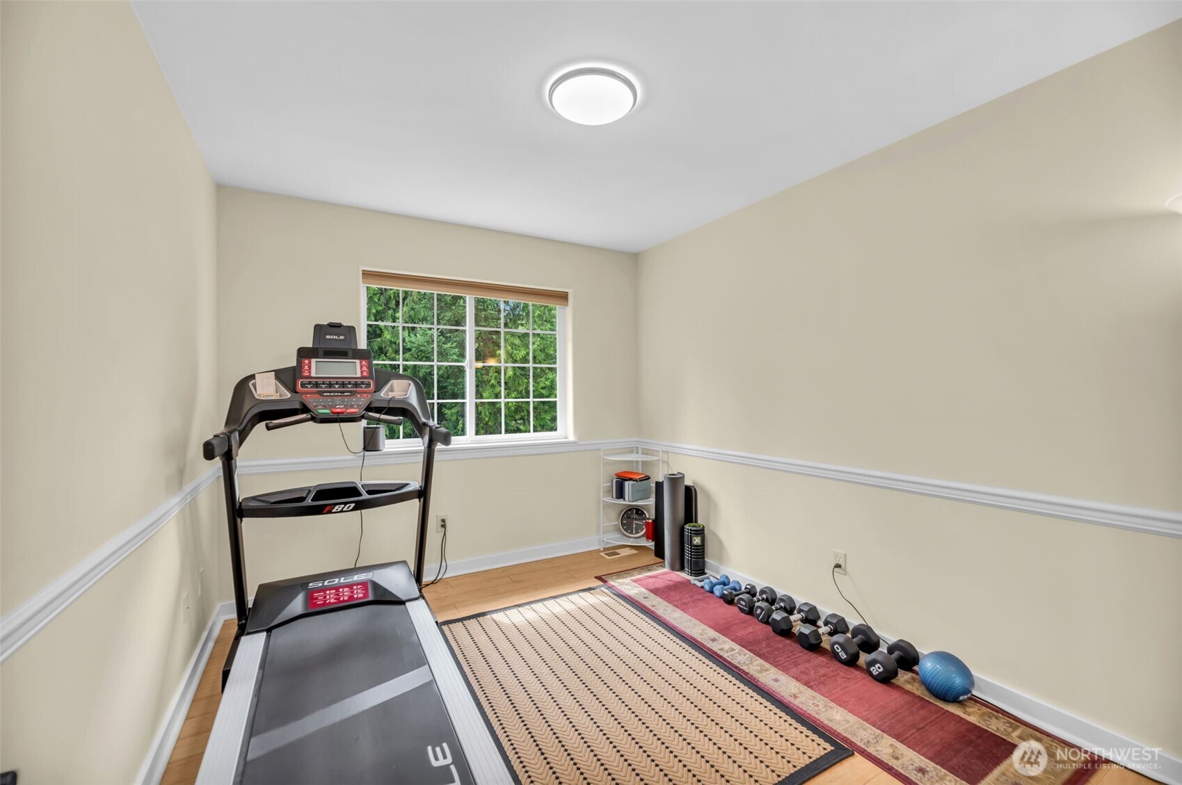 18005 252nd Avenue Southeast Maple Valley, WA 98038 - Photo 22 of 40 a room with furniture and a window