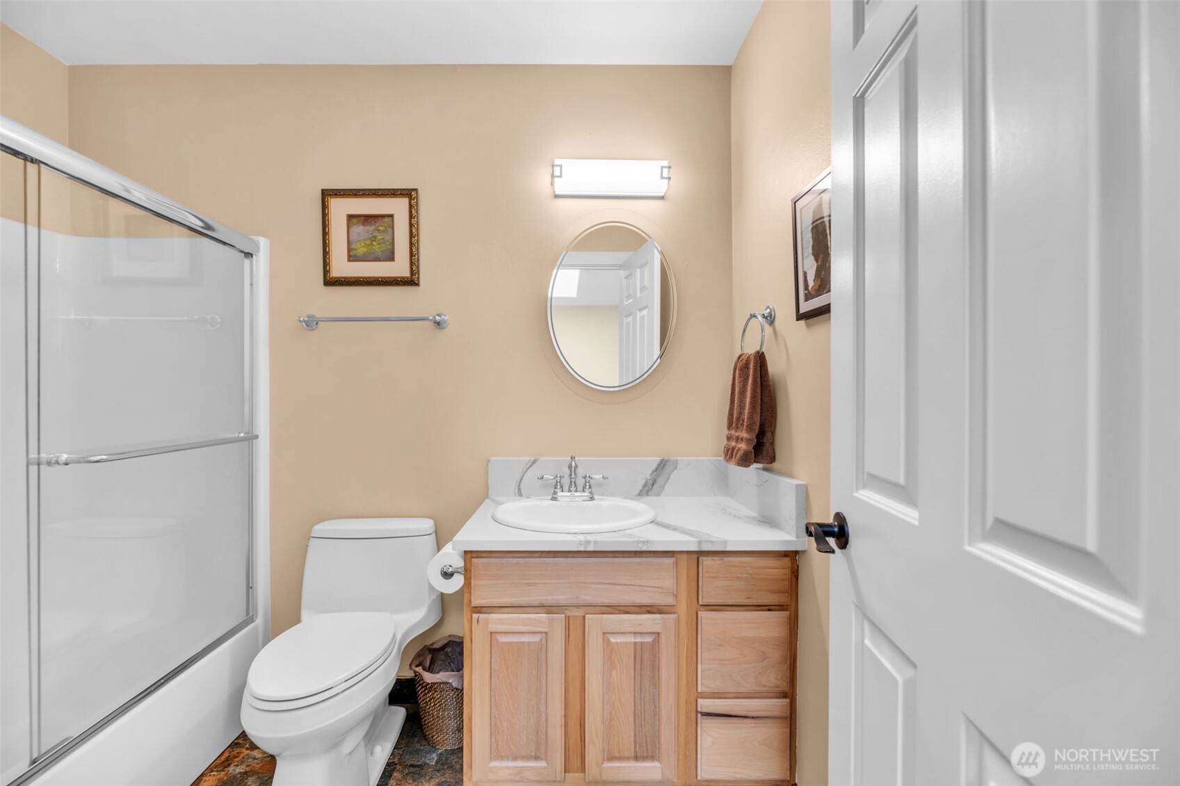 18005 252nd Avenue Southeast Maple Valley, WA 98038 - Photo 25 of 40 a bathroom with a granite countertop toilet sink and mirror
