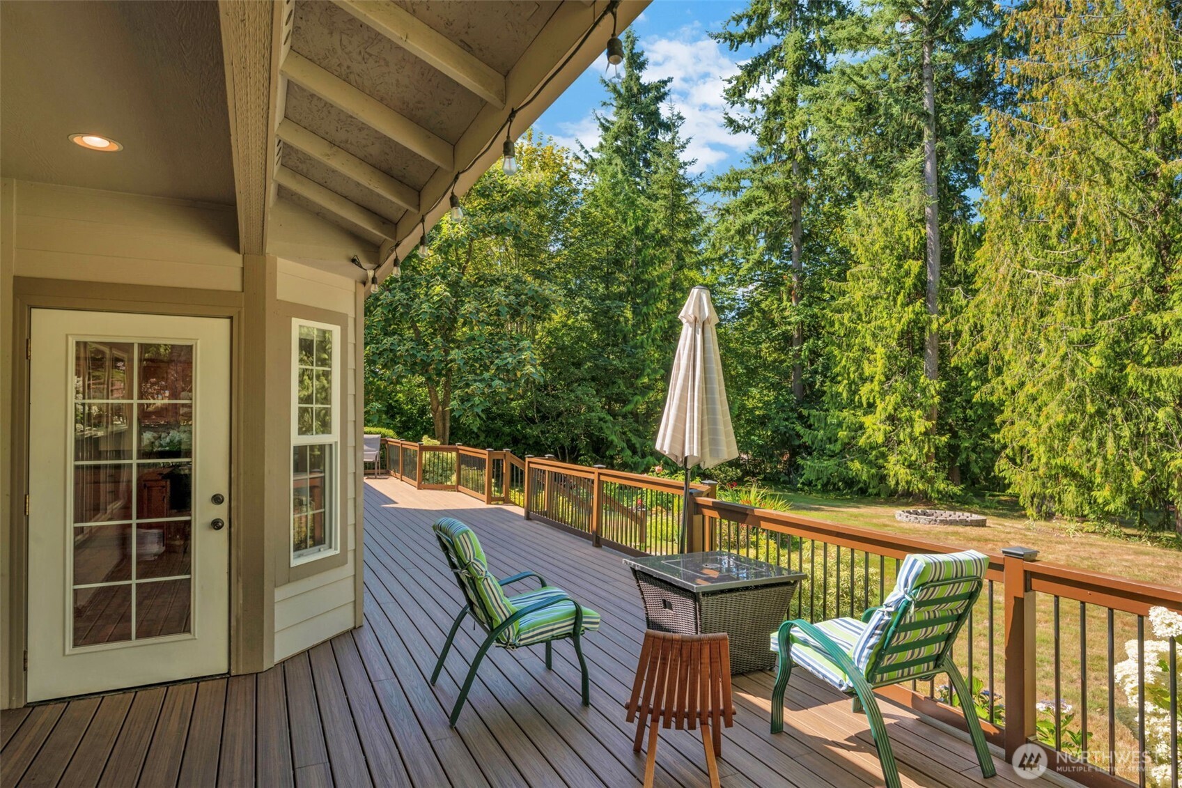 18005 252nd Avenue Southeast Maple Valley, WA 98038 - Photo 27 of 40 a view of deck with furniture and trees