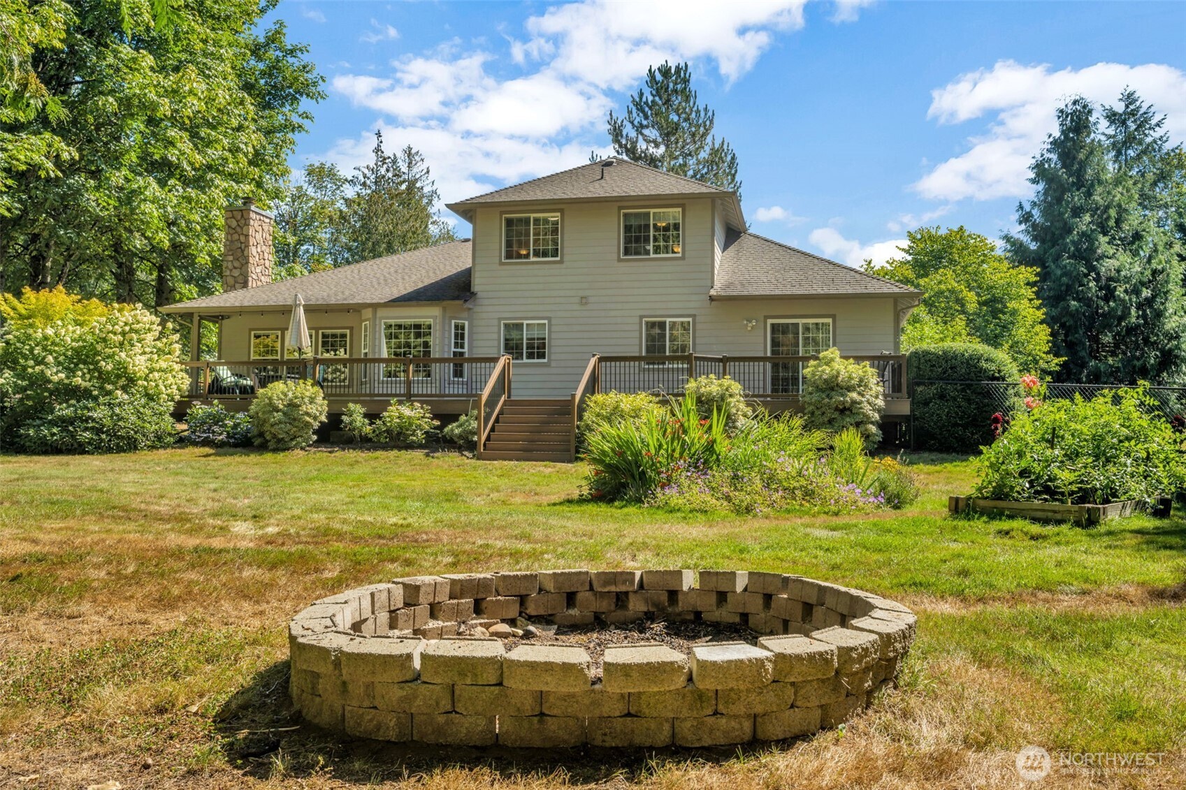 18005 252nd Avenue Southeast Maple Valley, WA 98038 - Photo 31 of 40 a view of a house with a yard