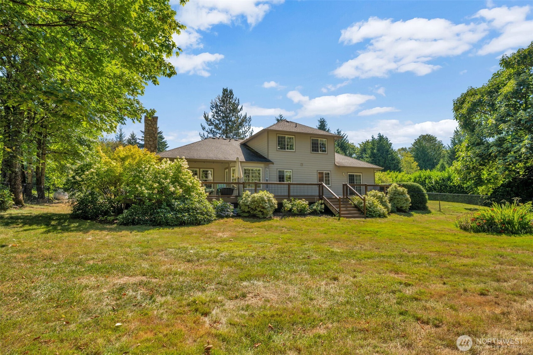 18005 252nd Avenue Southeast Maple Valley, WA 98038 - Photo 32 of 40 a front view of a house with a yard