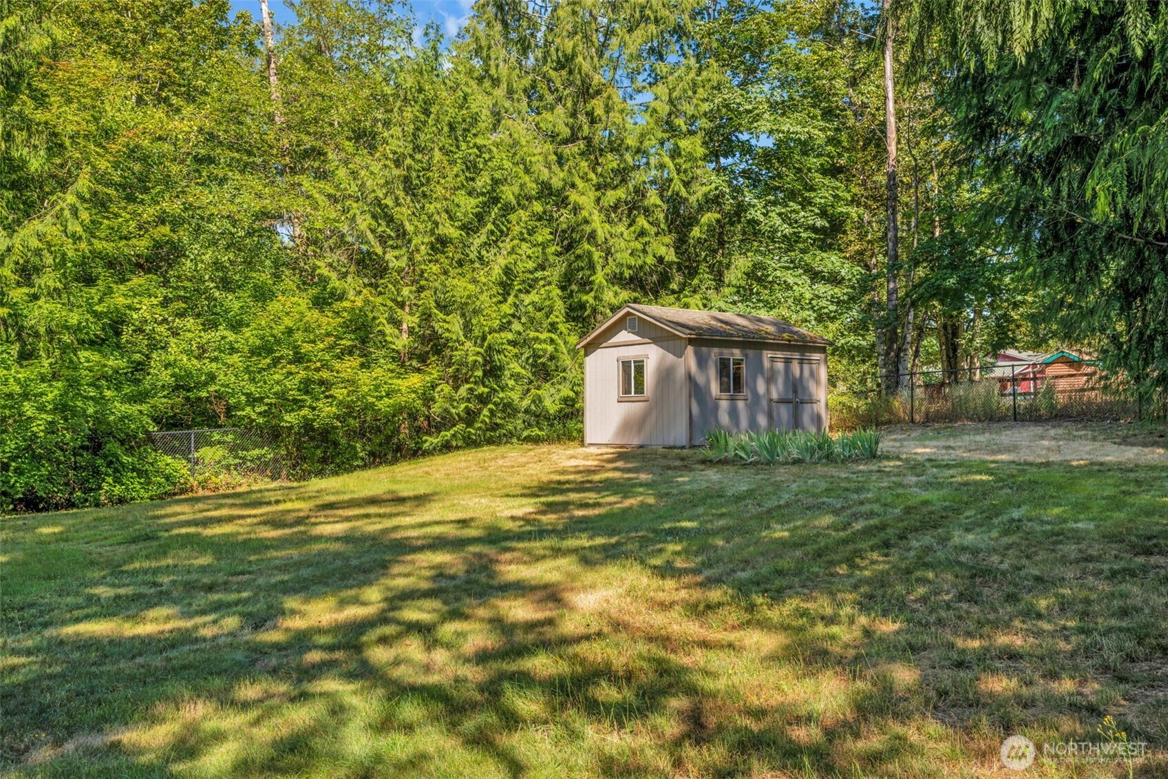 18005 252nd Avenue Southeast Maple Valley, WA 98038 - Photo 34 of 40 a view of a house with a backyard