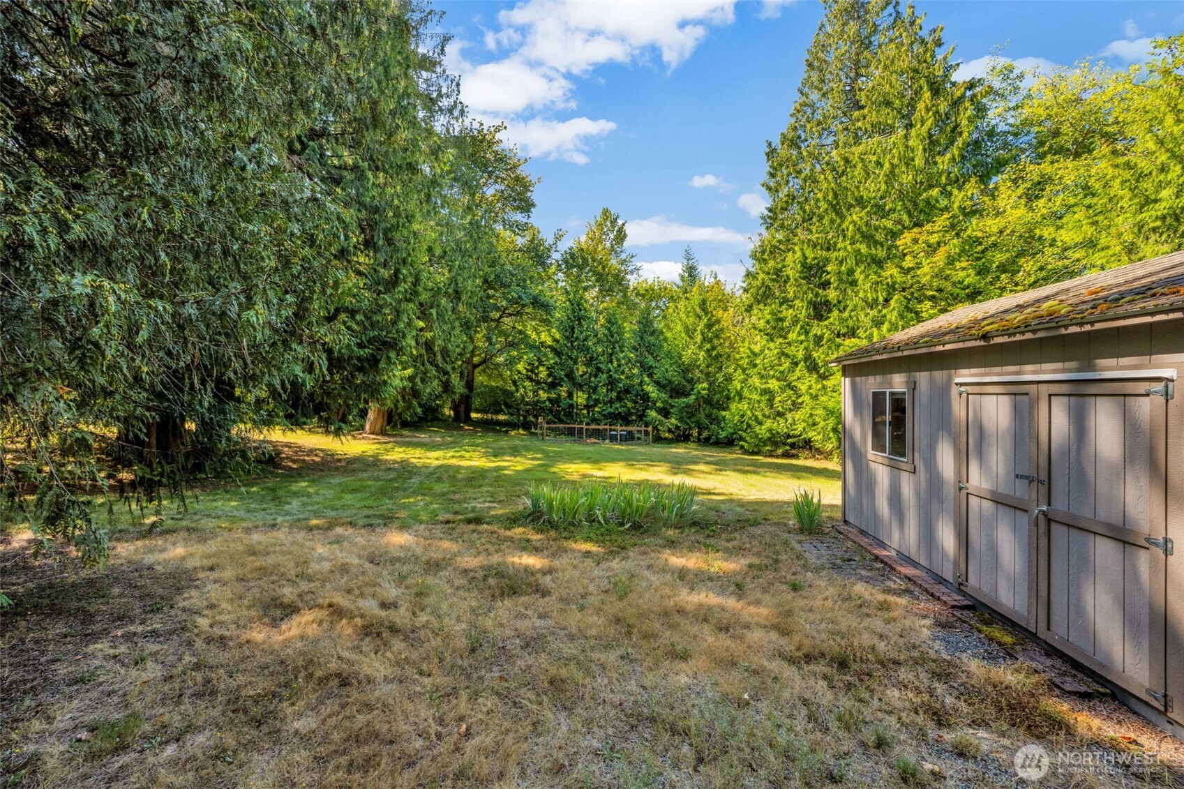 18005 252nd Avenue Southeast Maple Valley, WA 98038 - Photo 35 of 40 a view of yard with swimming pool and sitting area