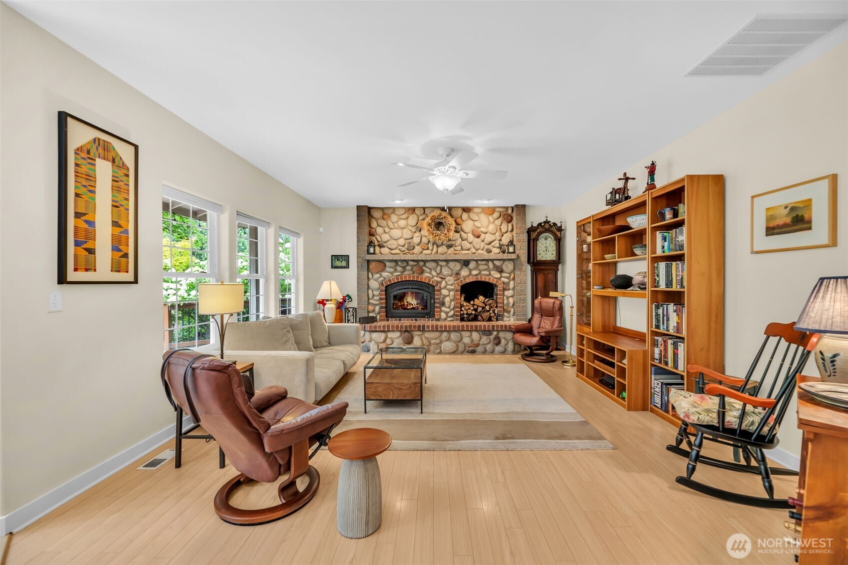 18005 252nd Avenue Southeast Maple Valley, WA 98038 - Photo 8 of 40 a living room with furniture a couch and two large window