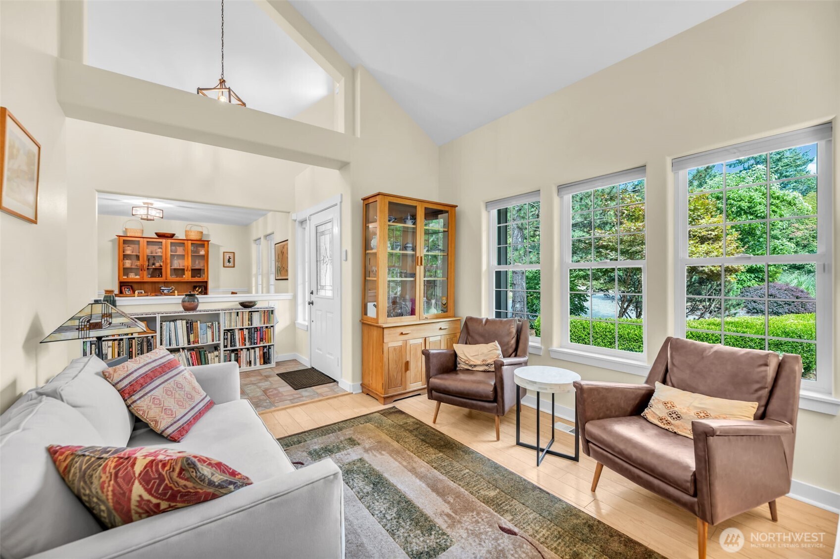 18005 252nd Avenue Southeast Maple Valley, WA 98038 - Photo 10 of 40 a living room with furniture and a large window