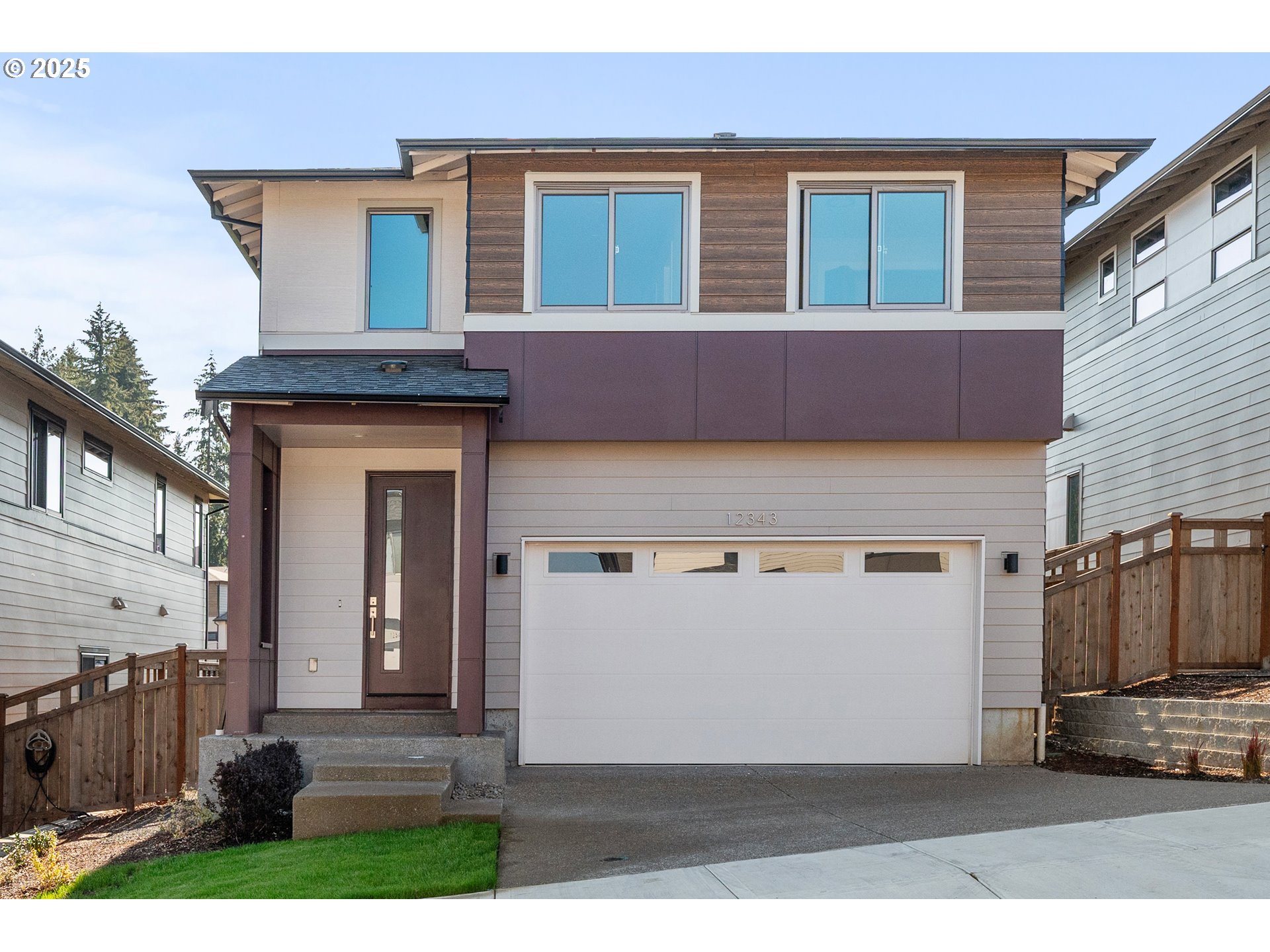 12343 Southeast Falling Rain Way Happy Valley, OR 97086 - Photo 1 of 39 a front view of a house with a yard