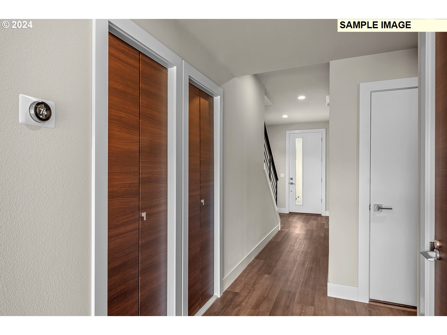12343 Southeast Falling Rain Way Happy Valley, OR 97086 - Photo 4 of 39 a view of a hallway with wooden floor